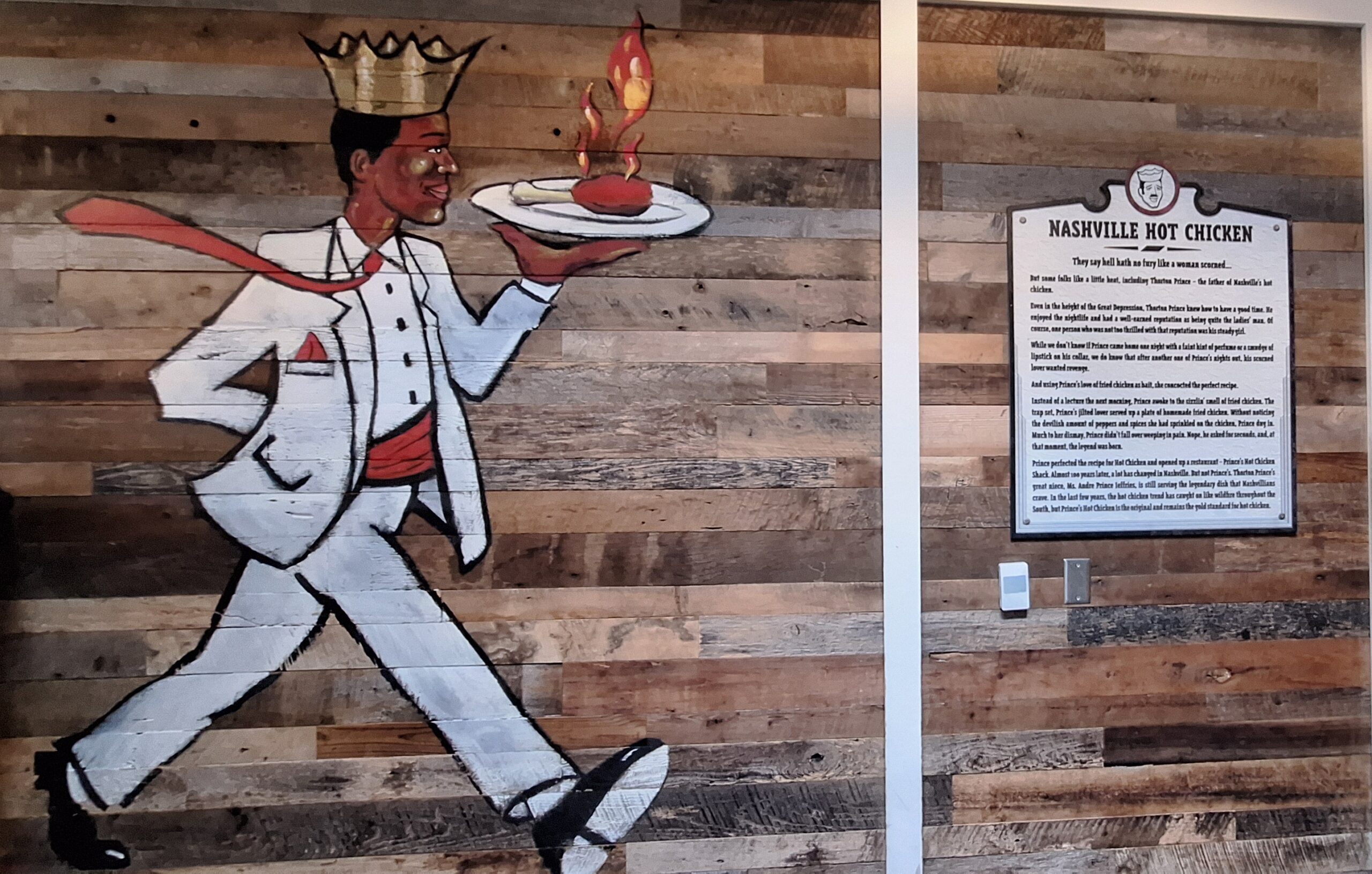 Premium Rouge a mural of a man holding a plate of food