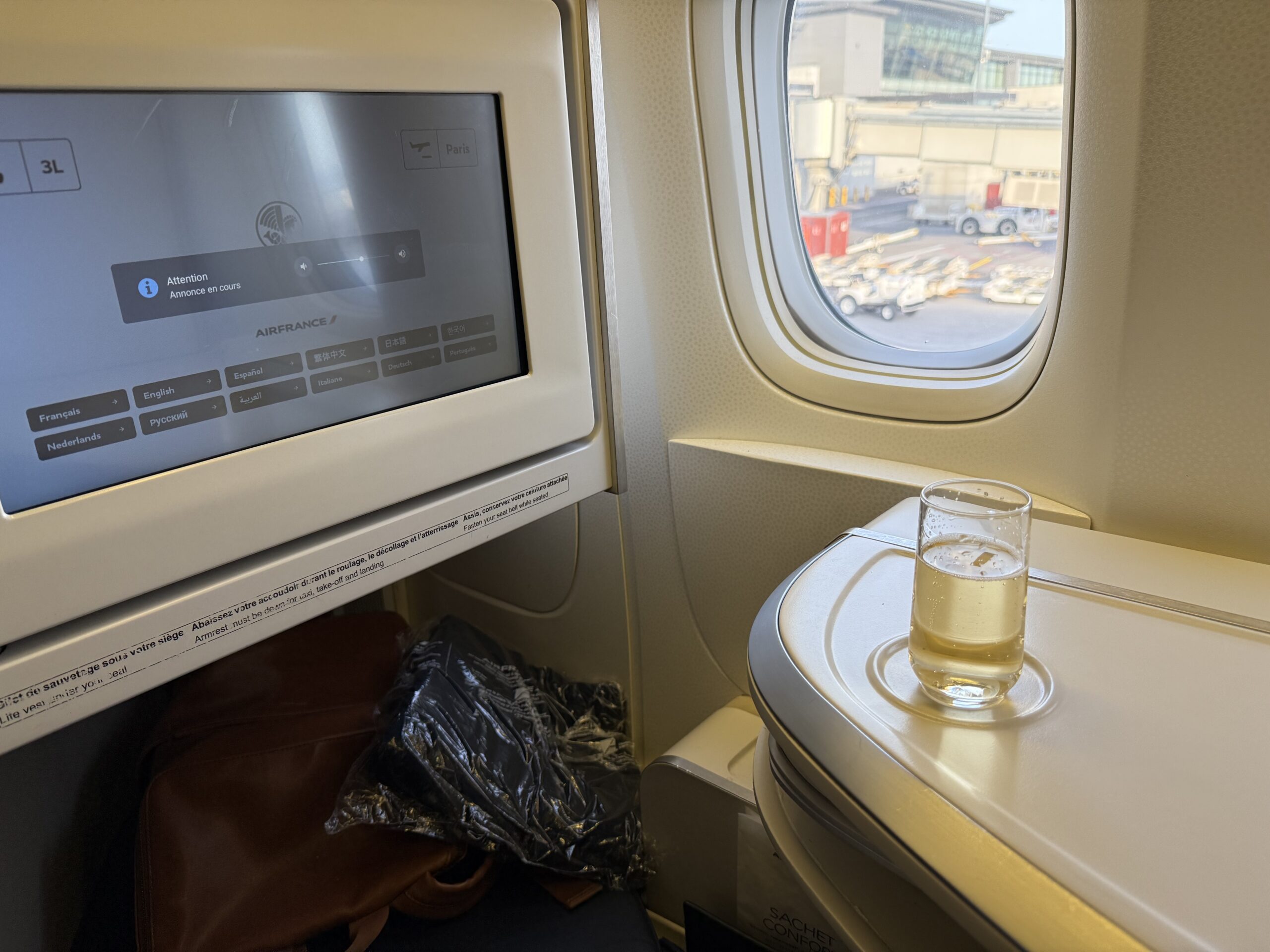Air France Ottawa to Paris a glass on the counter in a plane