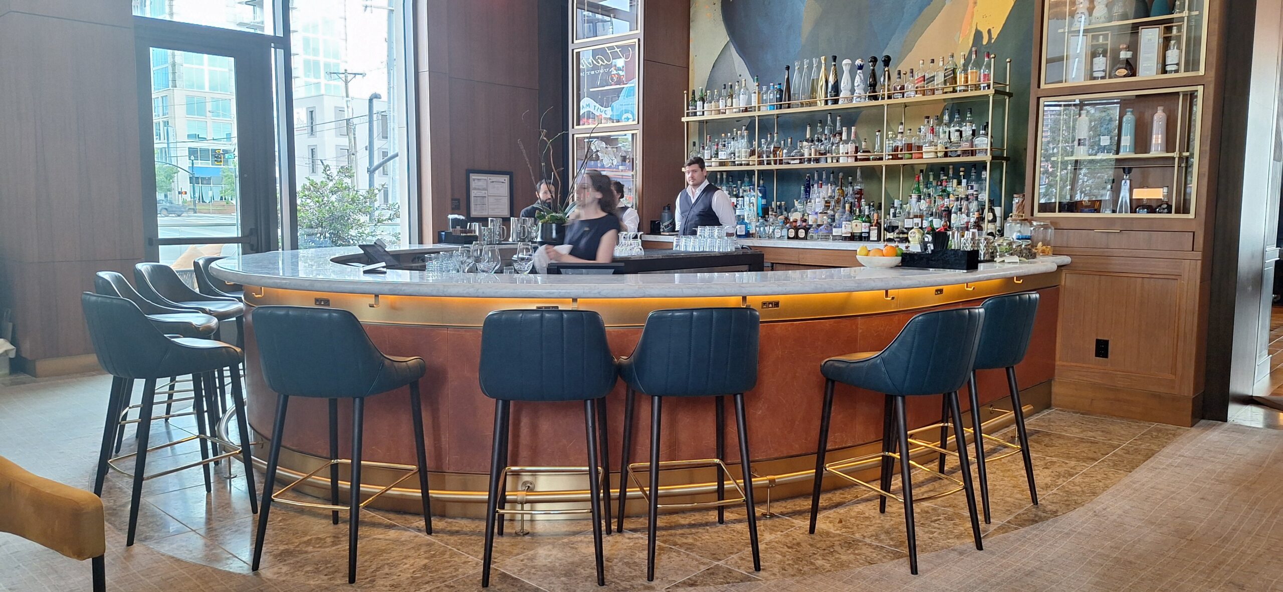 Conrad Nashville Review a bar with a couple of people behind it