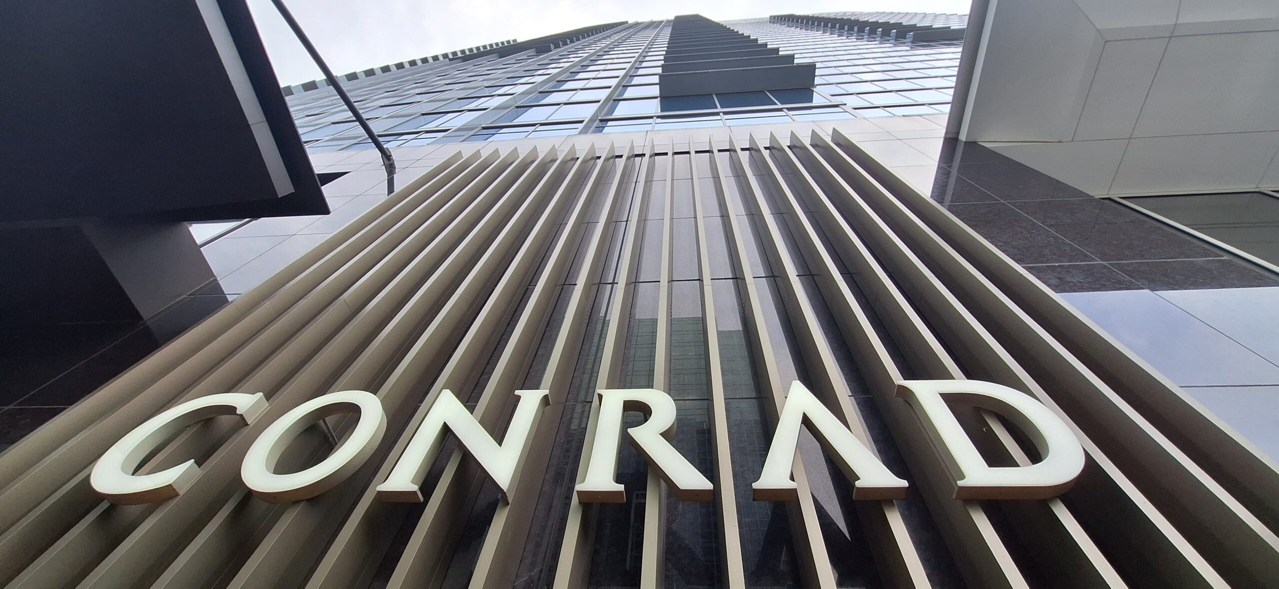 Conrad Nashville Review a tall building with white letters on the side