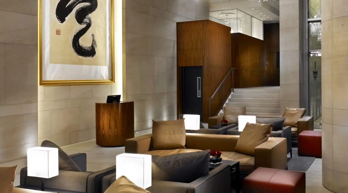 a lobby with a staircase and a couch