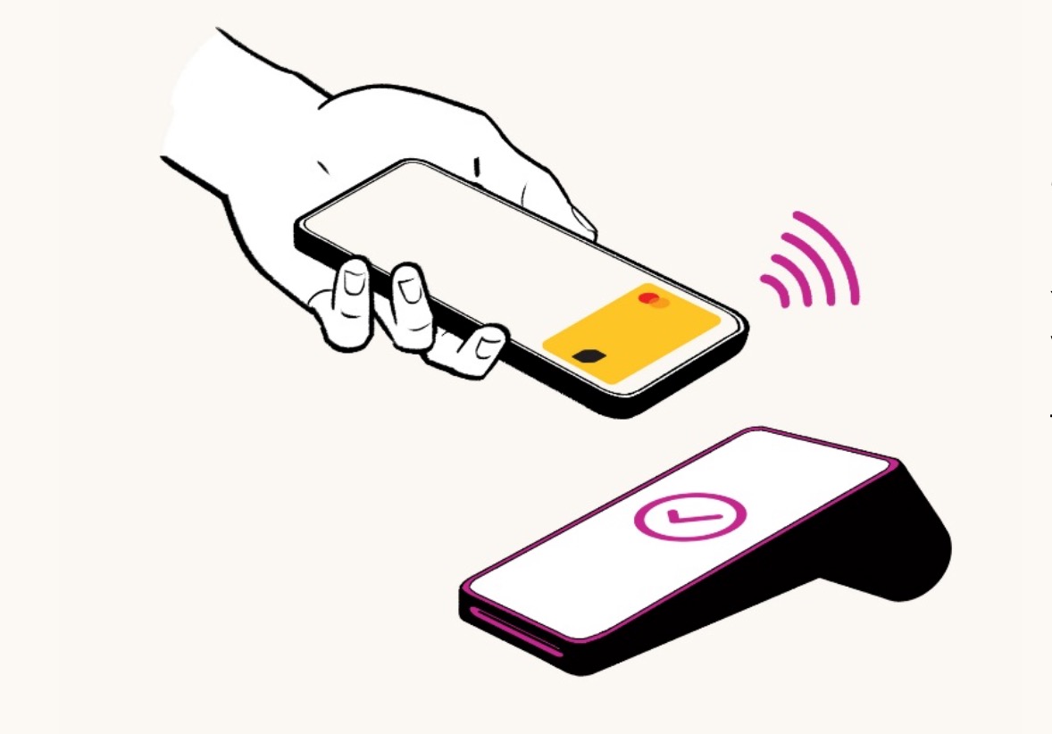 a hand holding a phone and a credit card