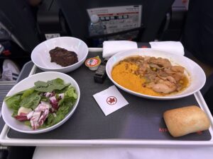 Air Canada Premium Economy a tray with food on it