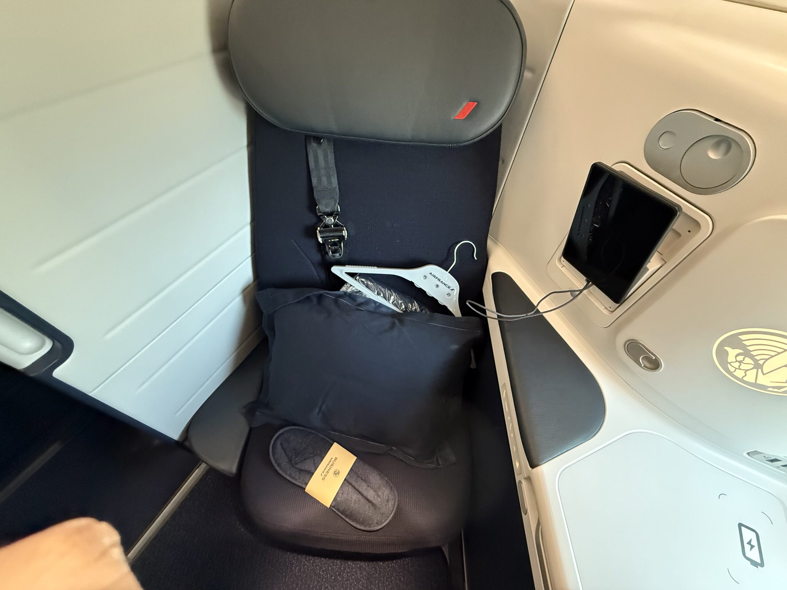 a seat with a pillow and a swinger on it