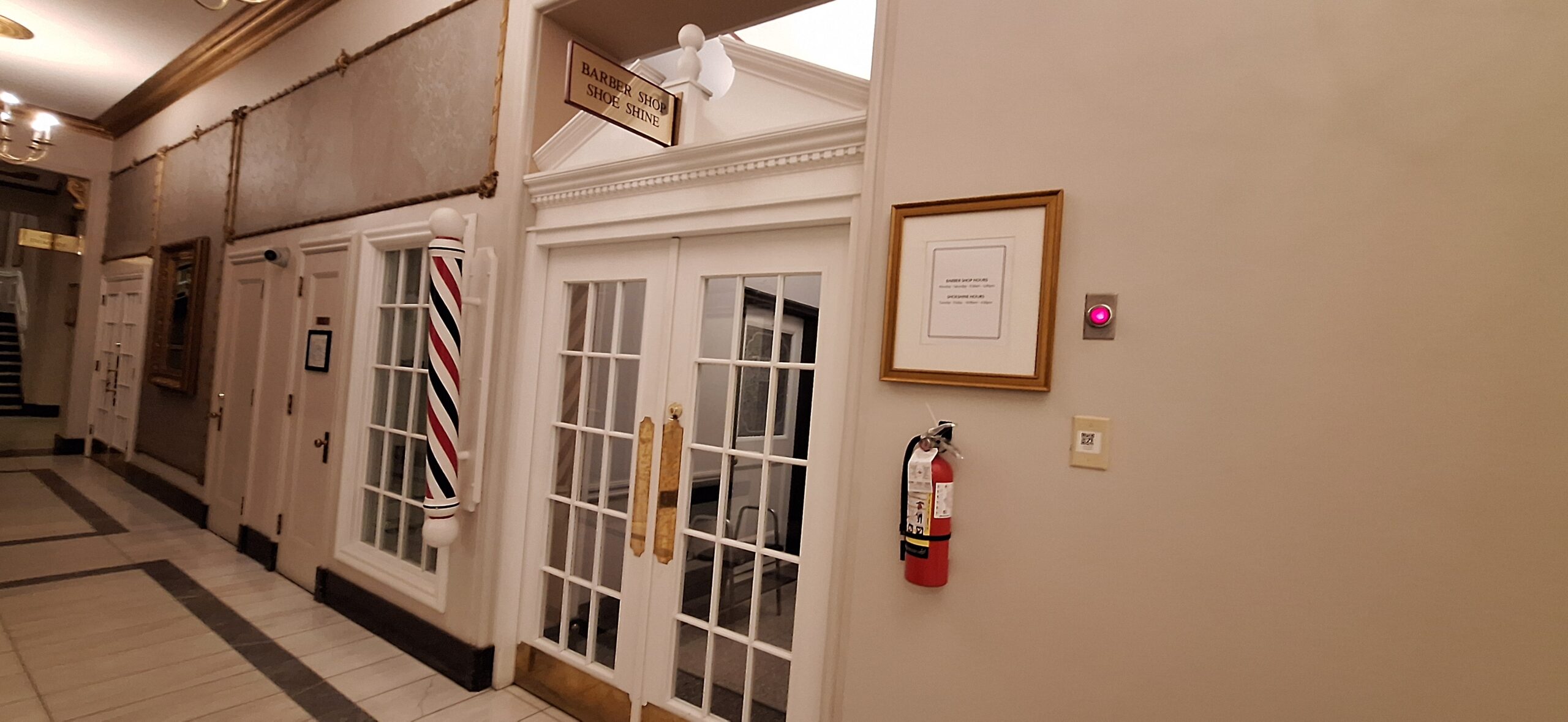 a door with glass doors and a fire extinguisher