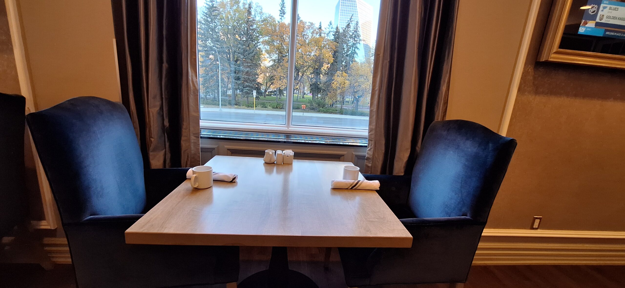 a table with napkins and cups on it