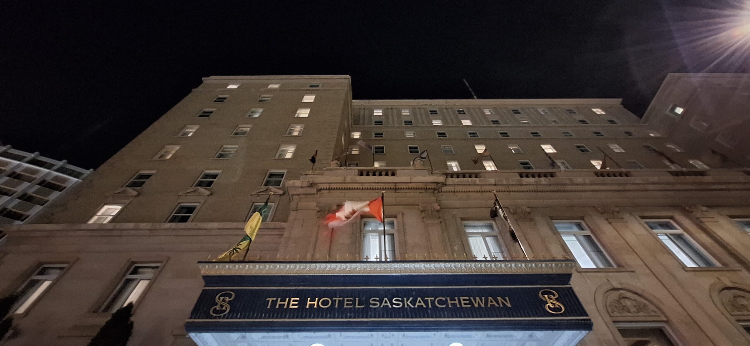 a building with flags on the front