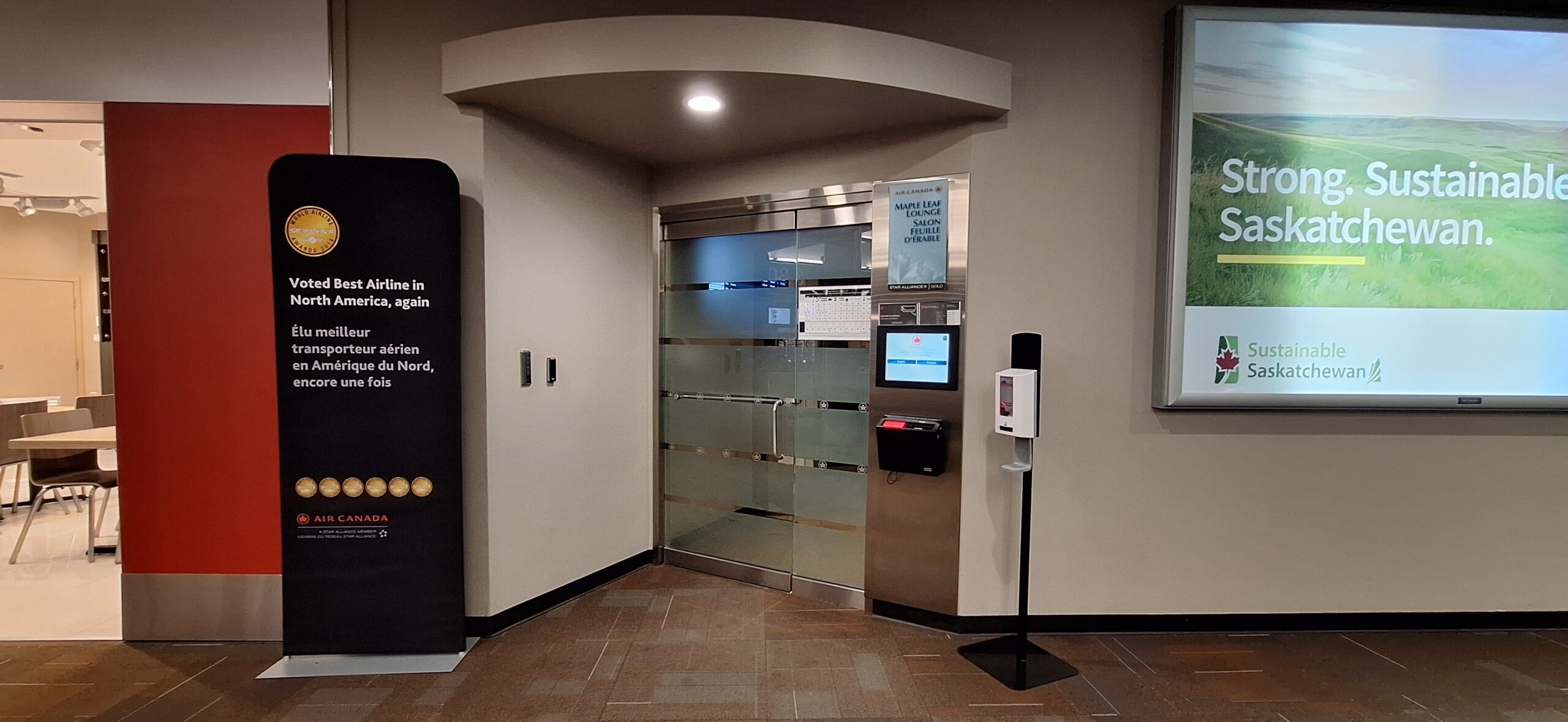 an elevator with glass doors