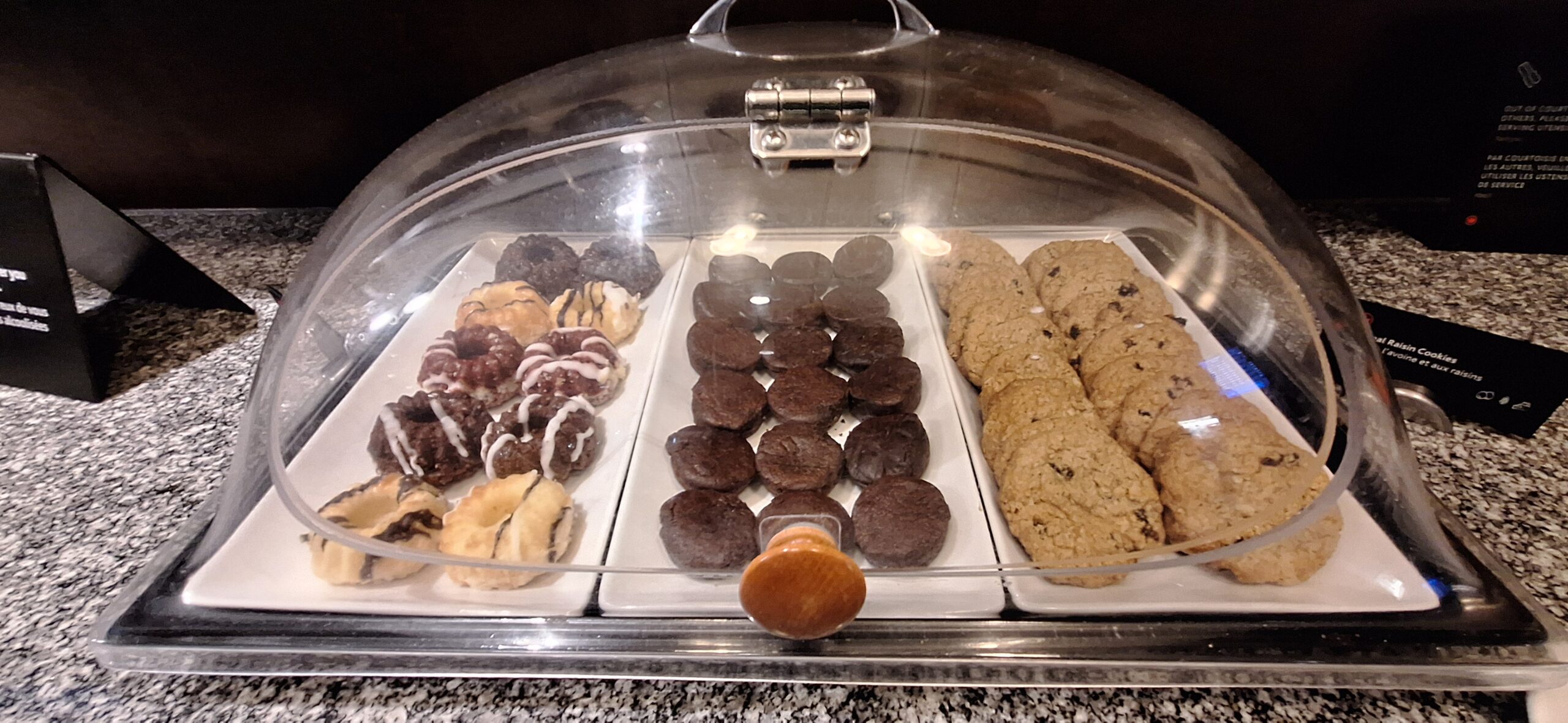a tray of cookies and donuts