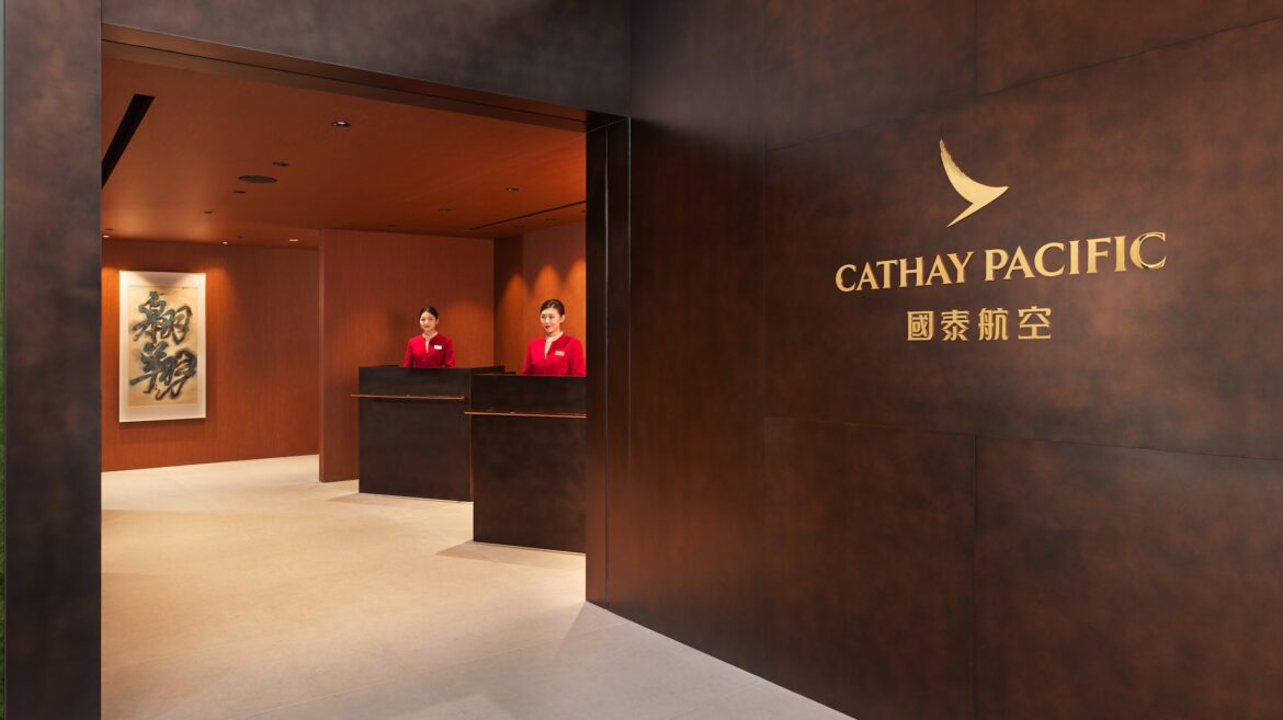 a group of people standing behind desks in a building