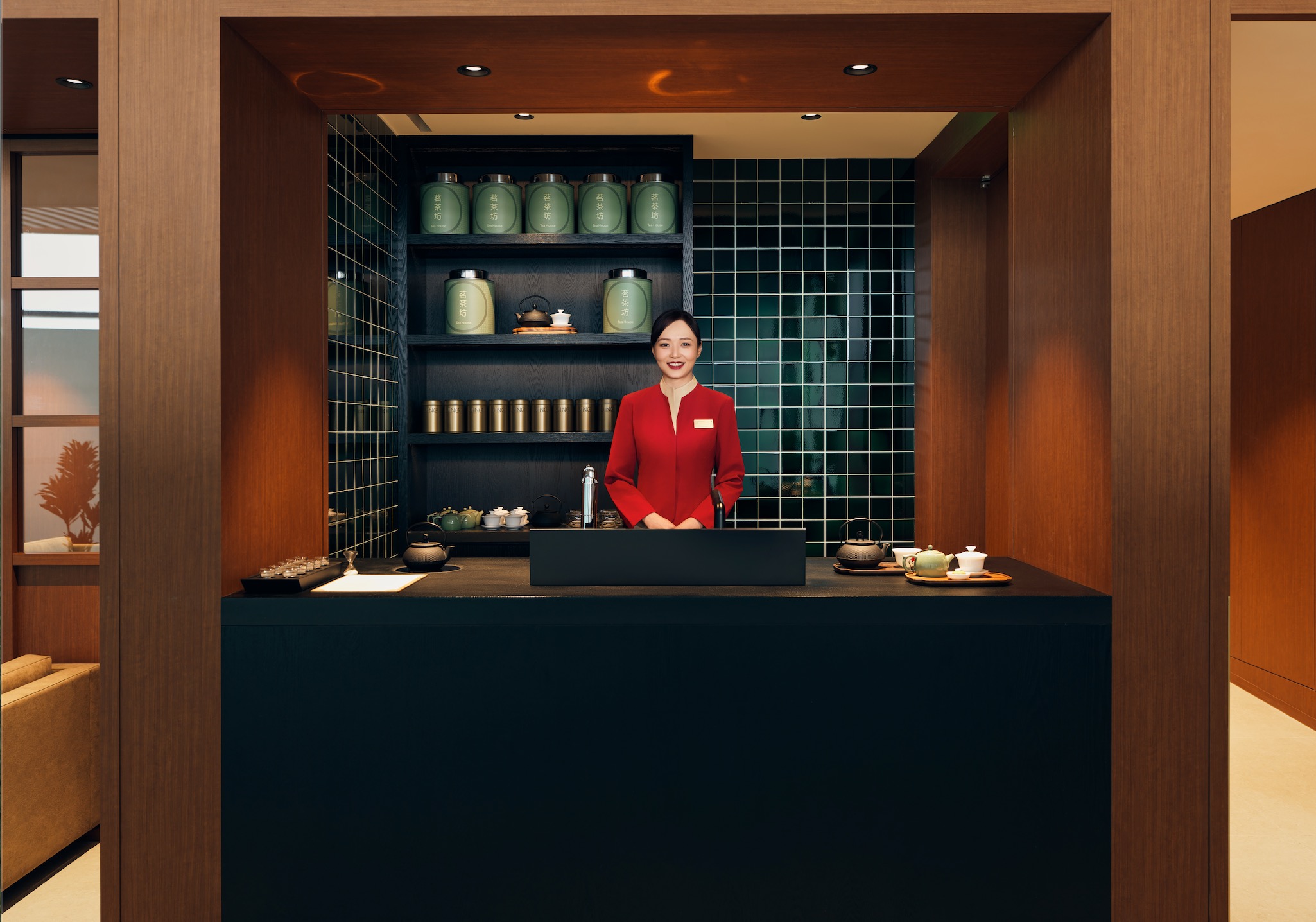 a woman standing behind a counter