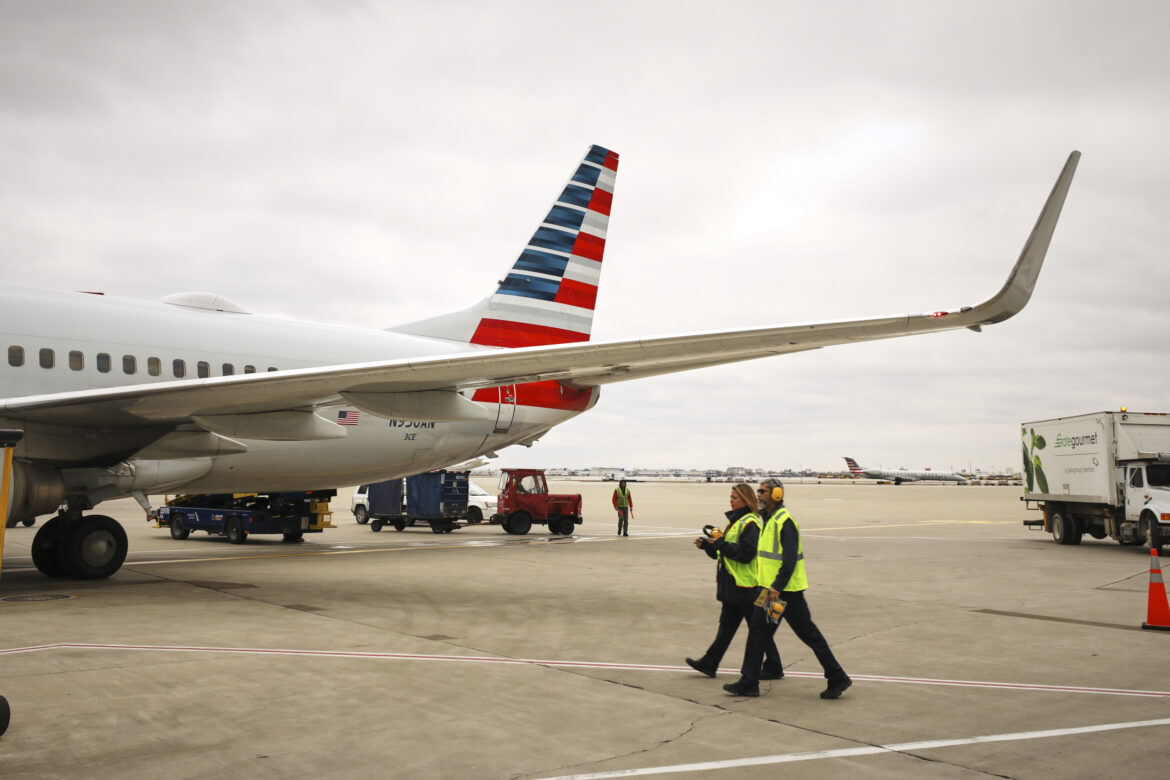 American Airlines people walking on the tarmac