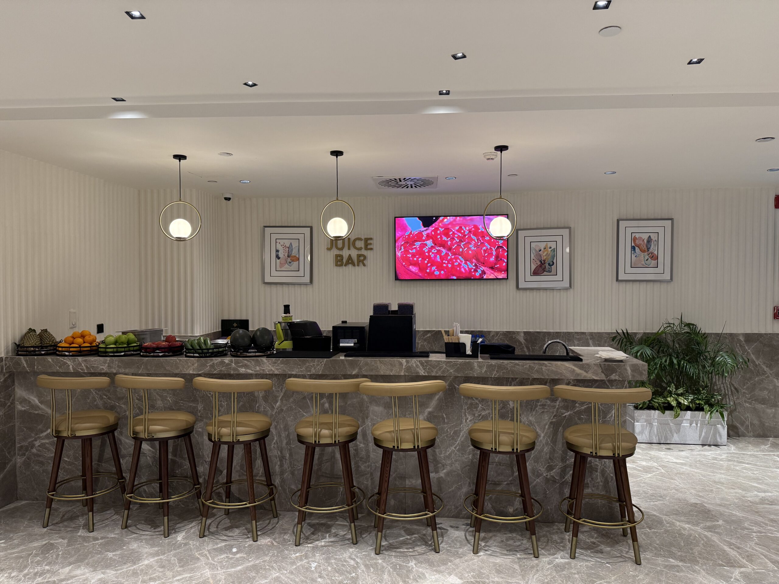 a bar with chairs and a counter