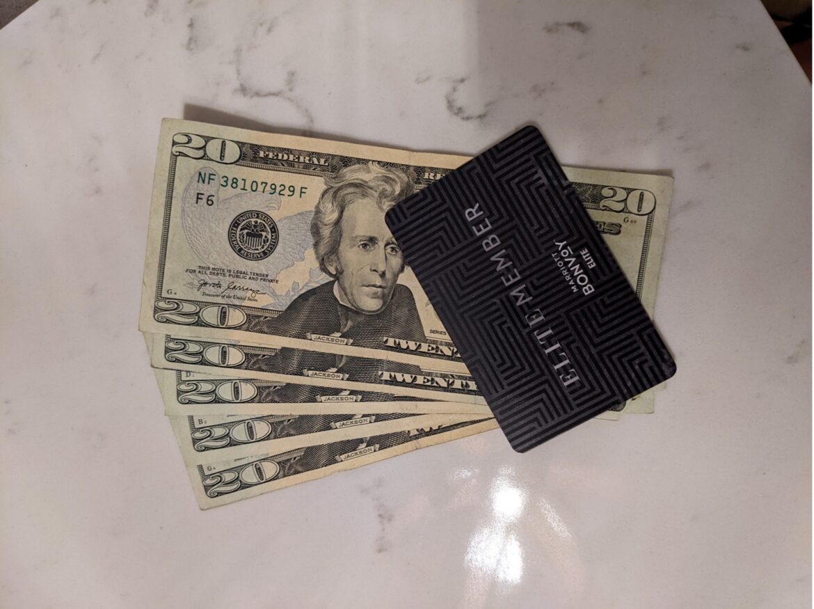 a stack of money on a marble surface