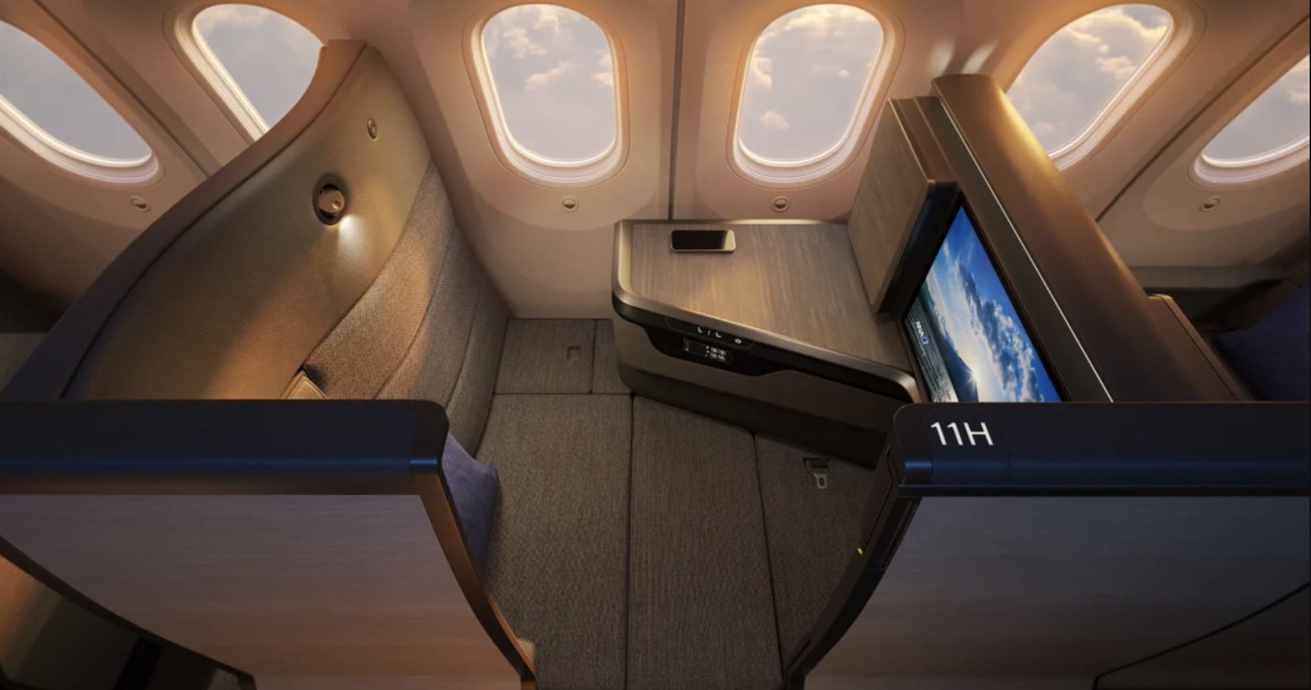 the inside of an airplane with a television and windows