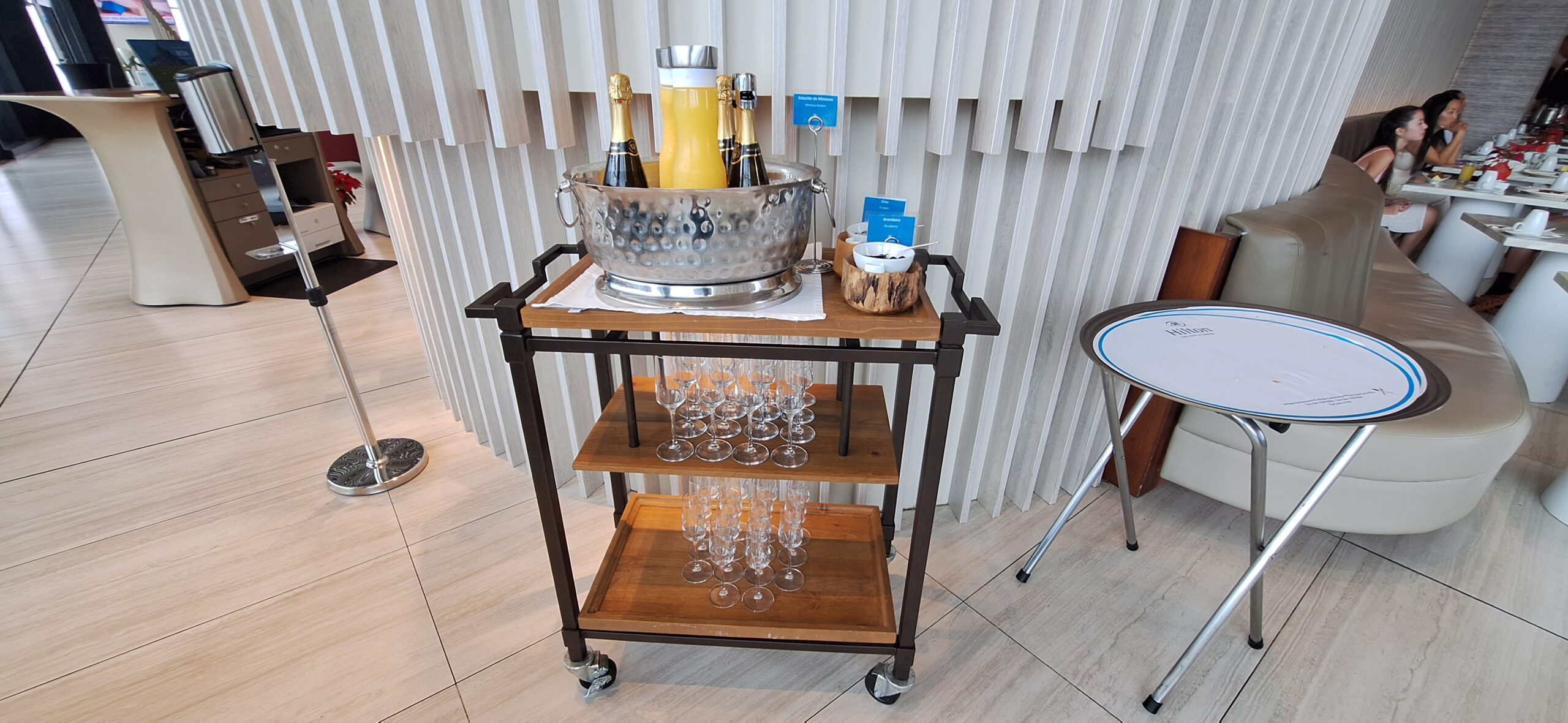 a cart with champagne and glasses on it