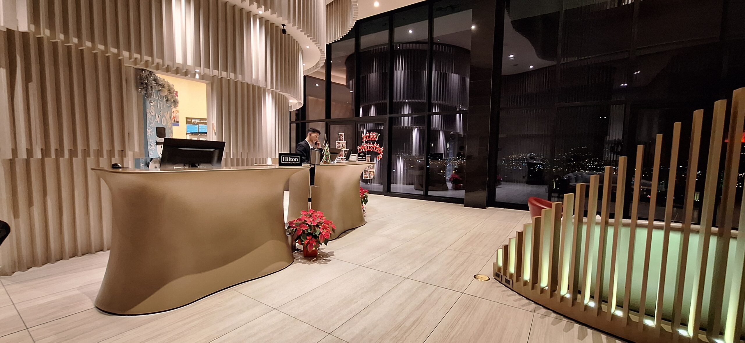 a man standing at a reception desk