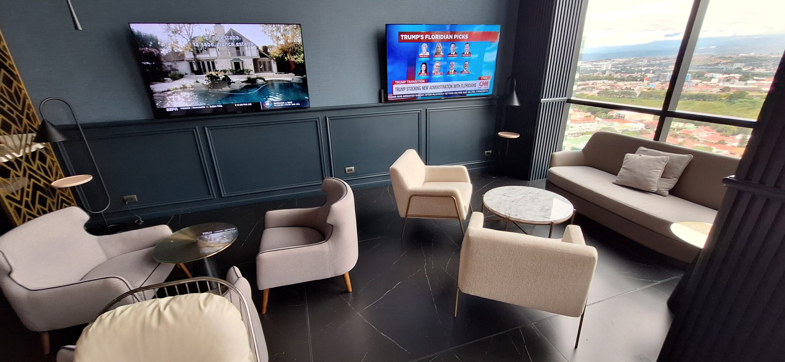 a room with a television and chairs