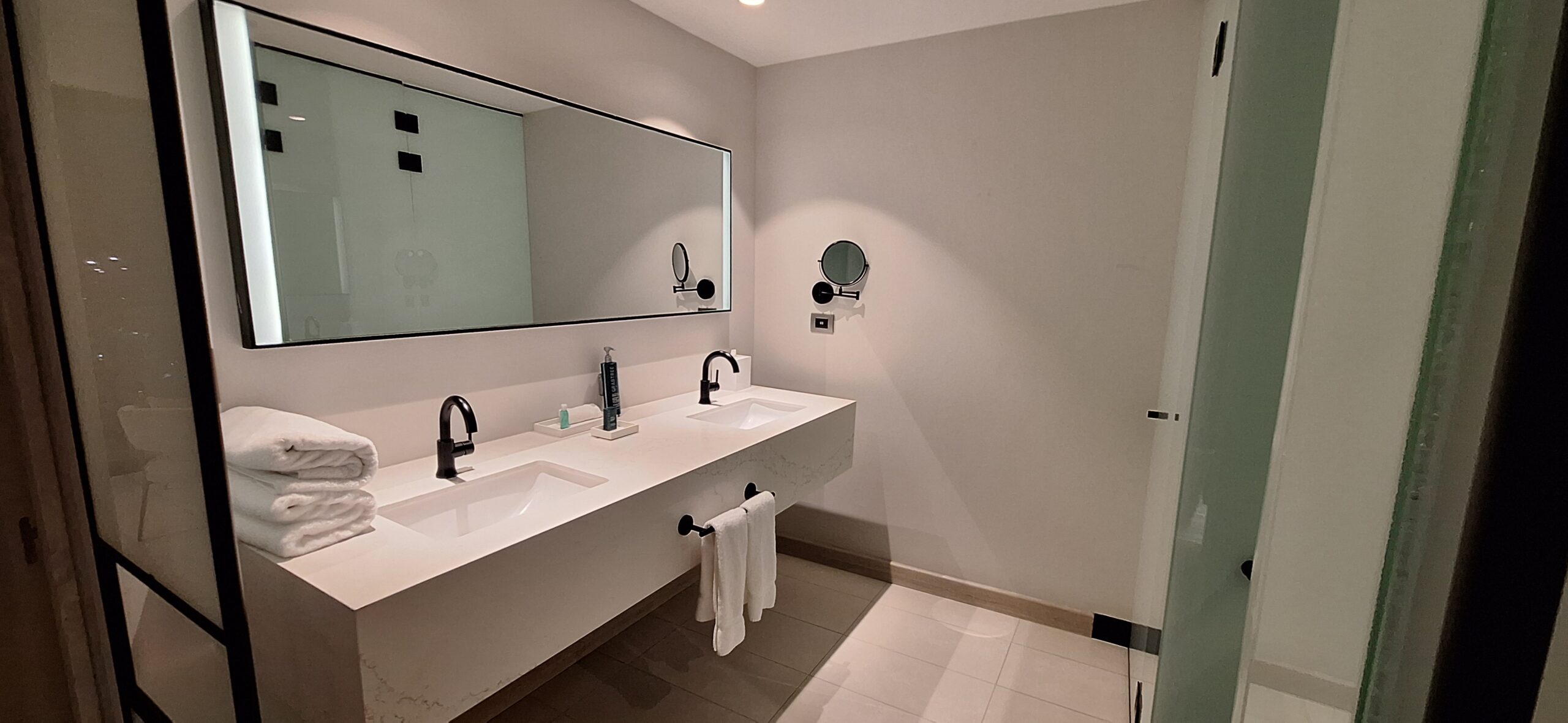 a bathroom with sinks and mirrors