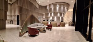 Hilton Honors Status Match Program a lobby with a reception desk and chairs