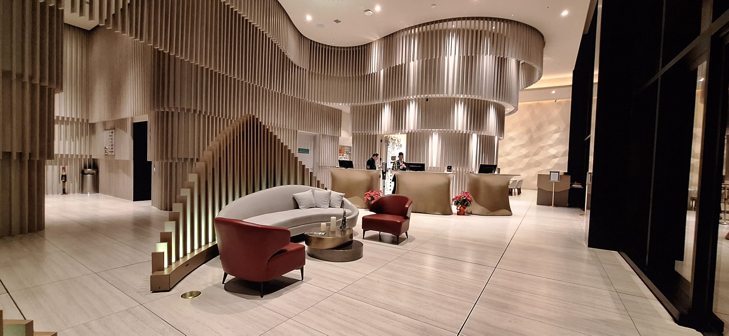 a lobby with a reception desk and chairs