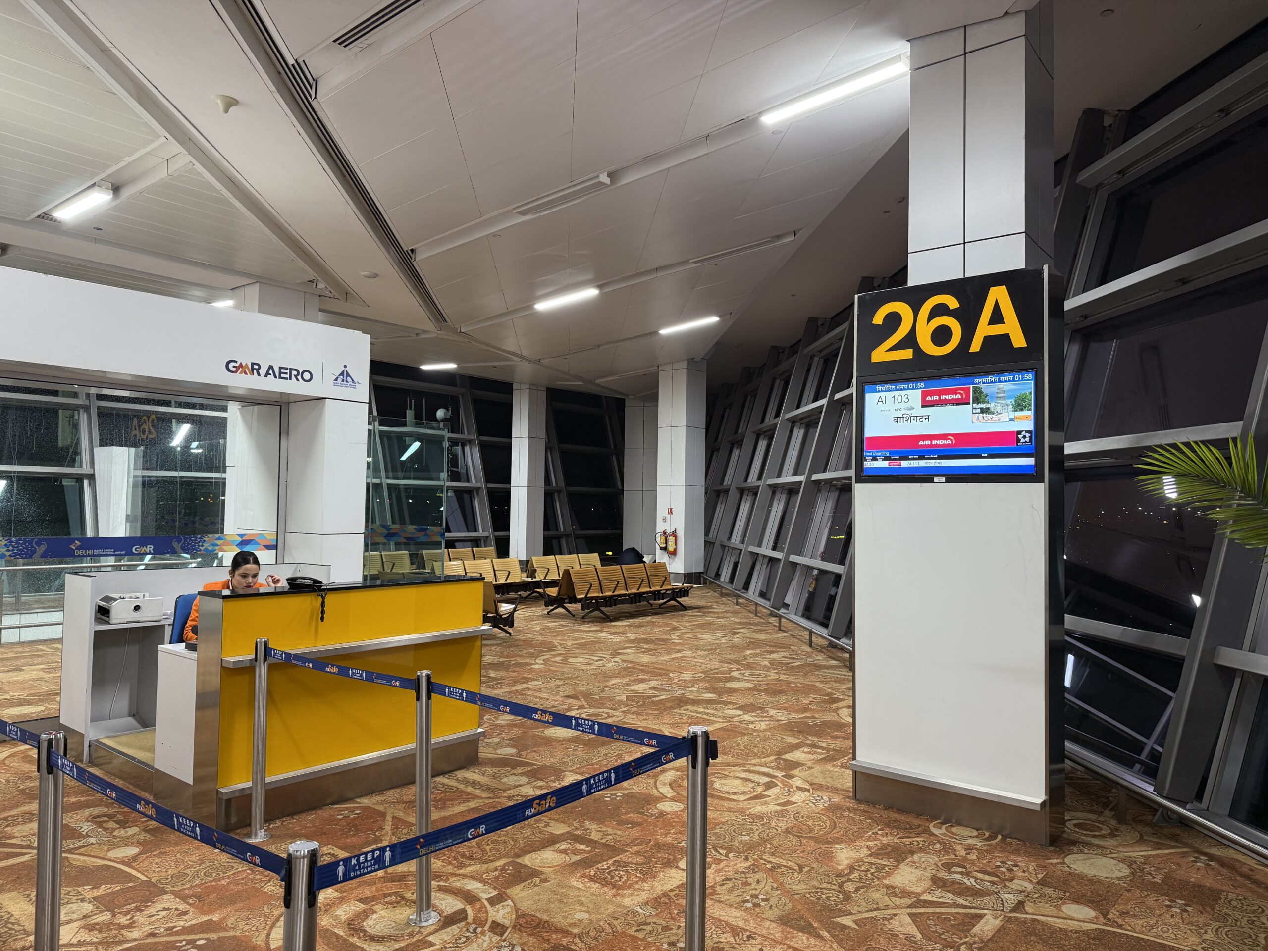a large airport with a yellow and white counter
