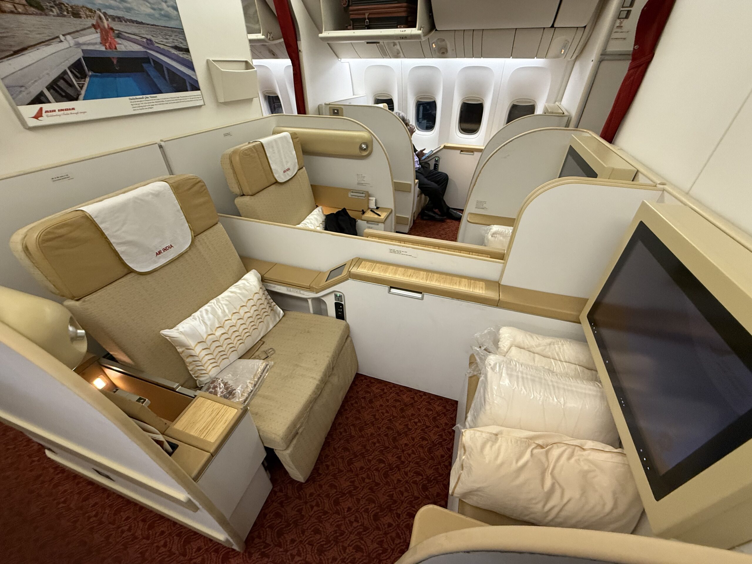 Air India First Class a room with a television and a television on the side