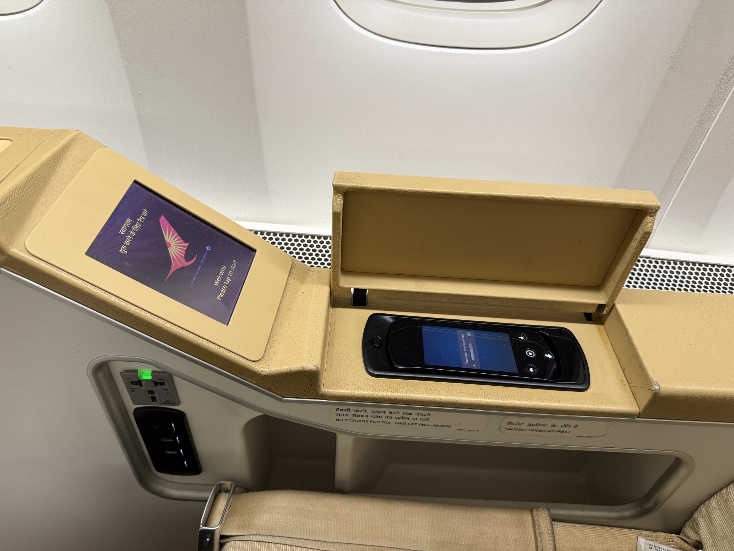 Air India First Class a phone in a box on a table
