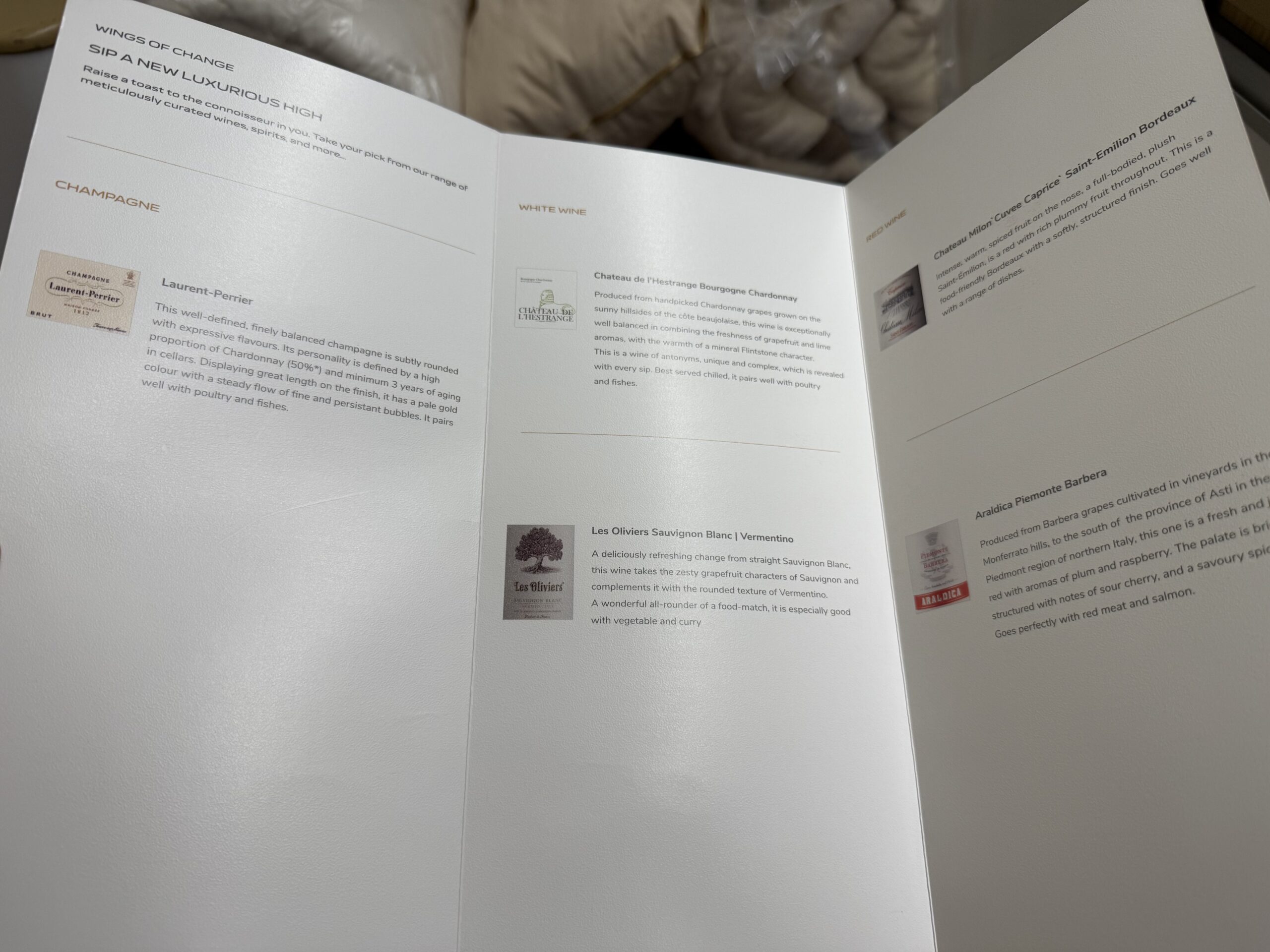 Air India First Class a white paper with writing on it