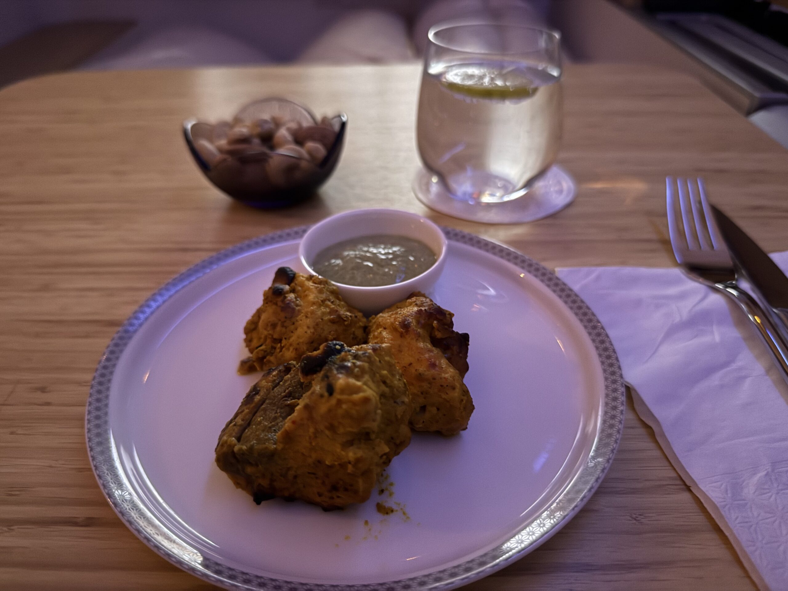 Air India First Class a plate of food on a table