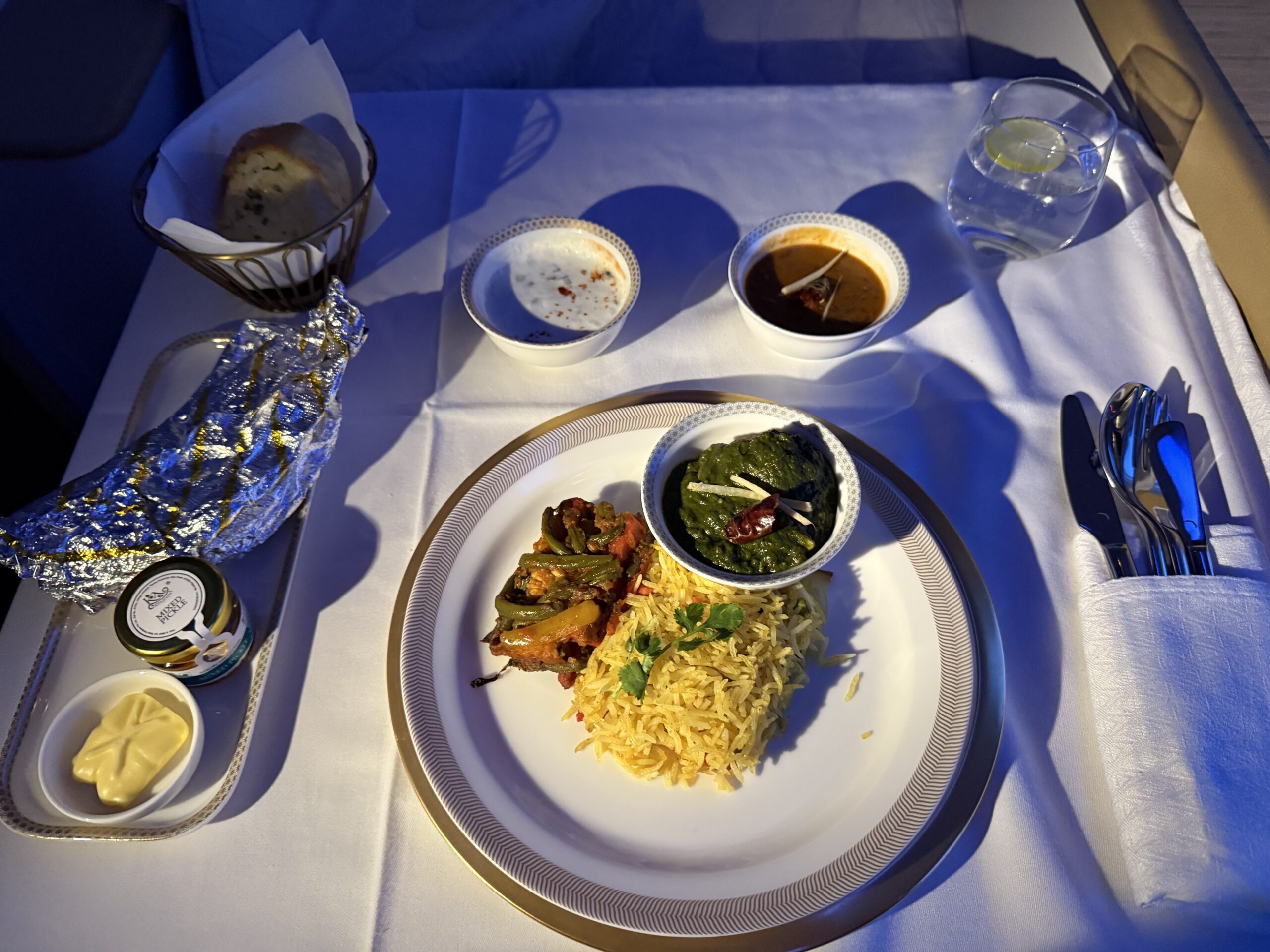 Air India First Class a plate of food on a table