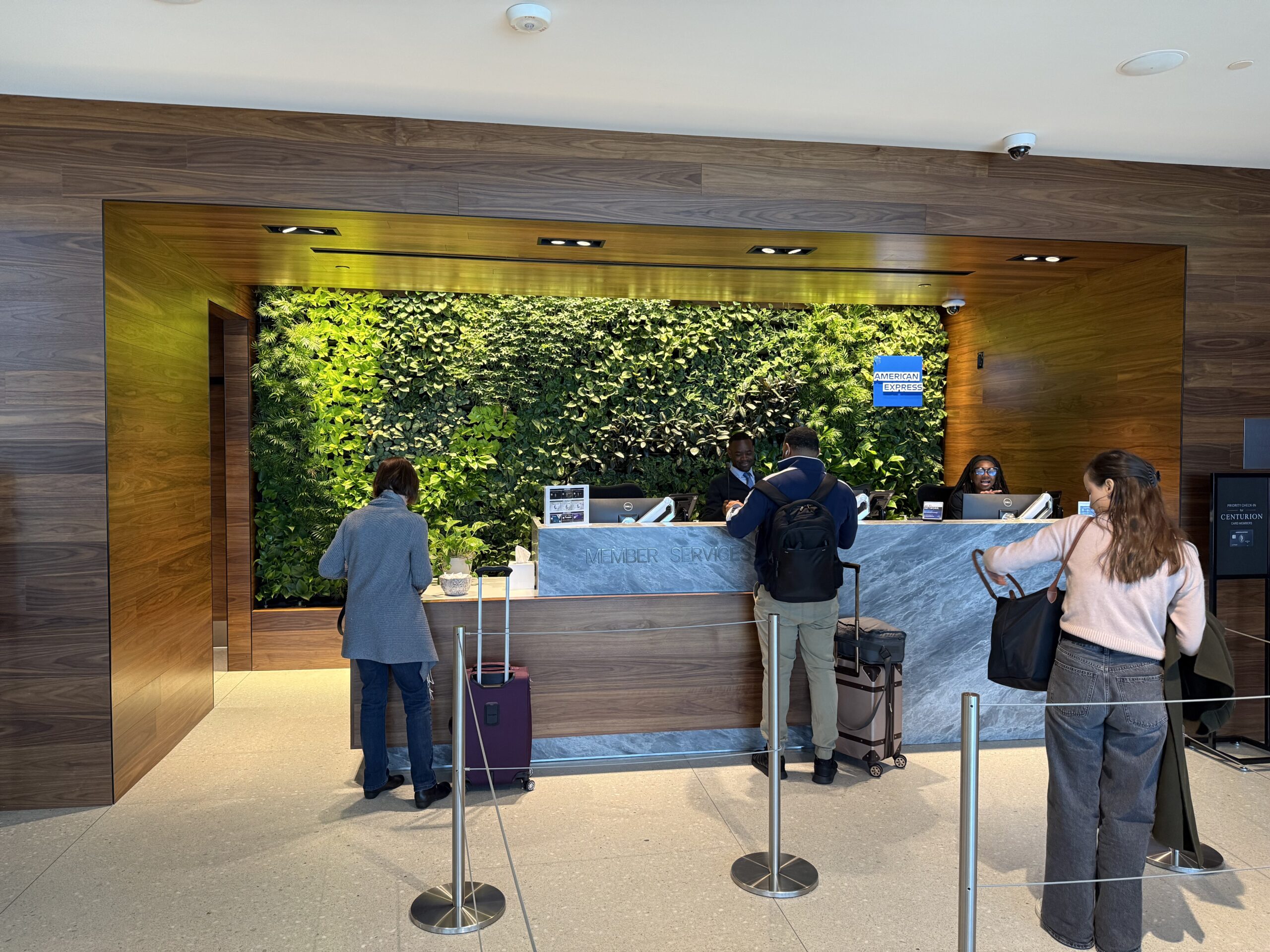 people standing at a desk