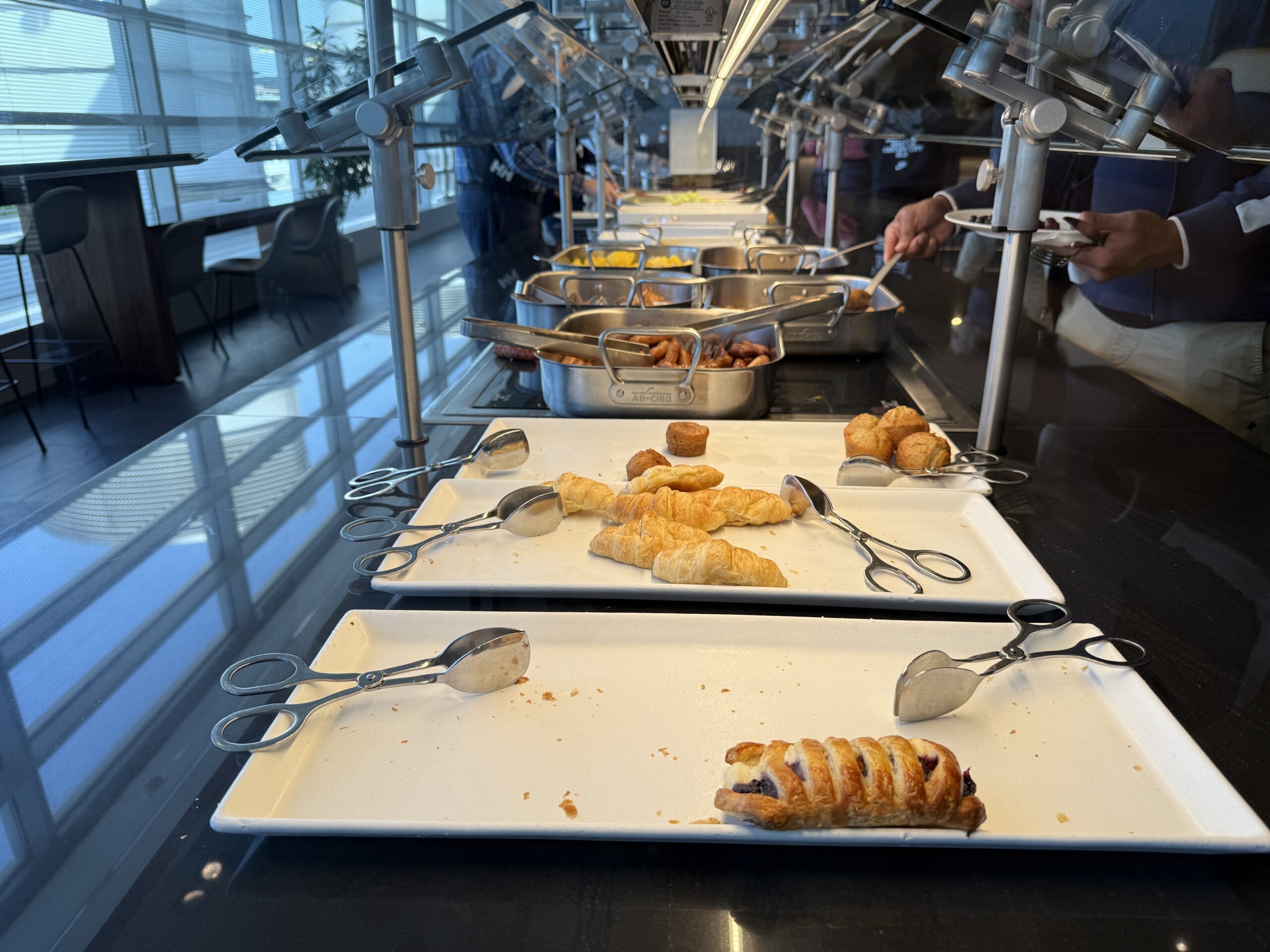 a buffet line with food on plates