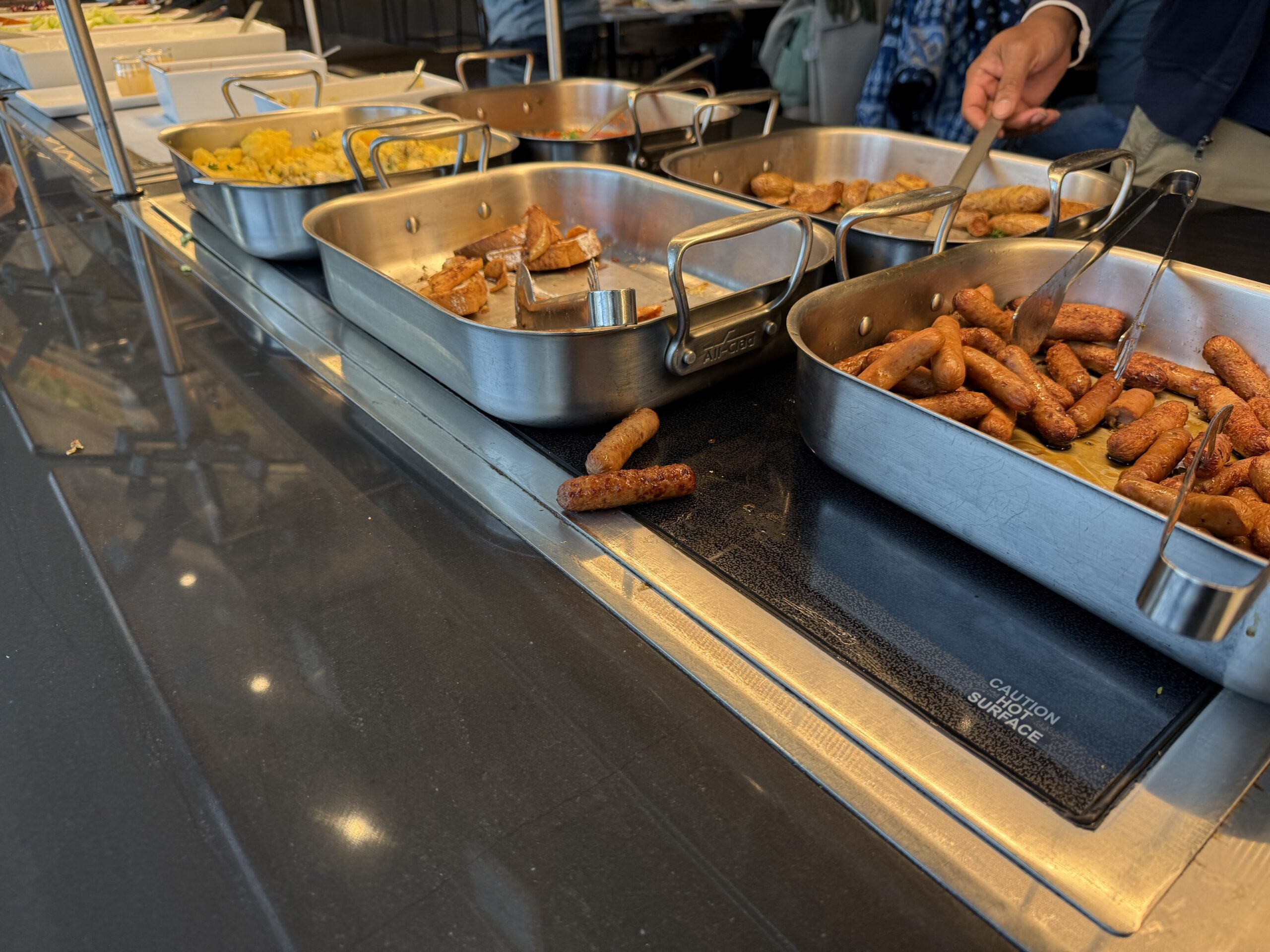 a group of metal pans with food in them