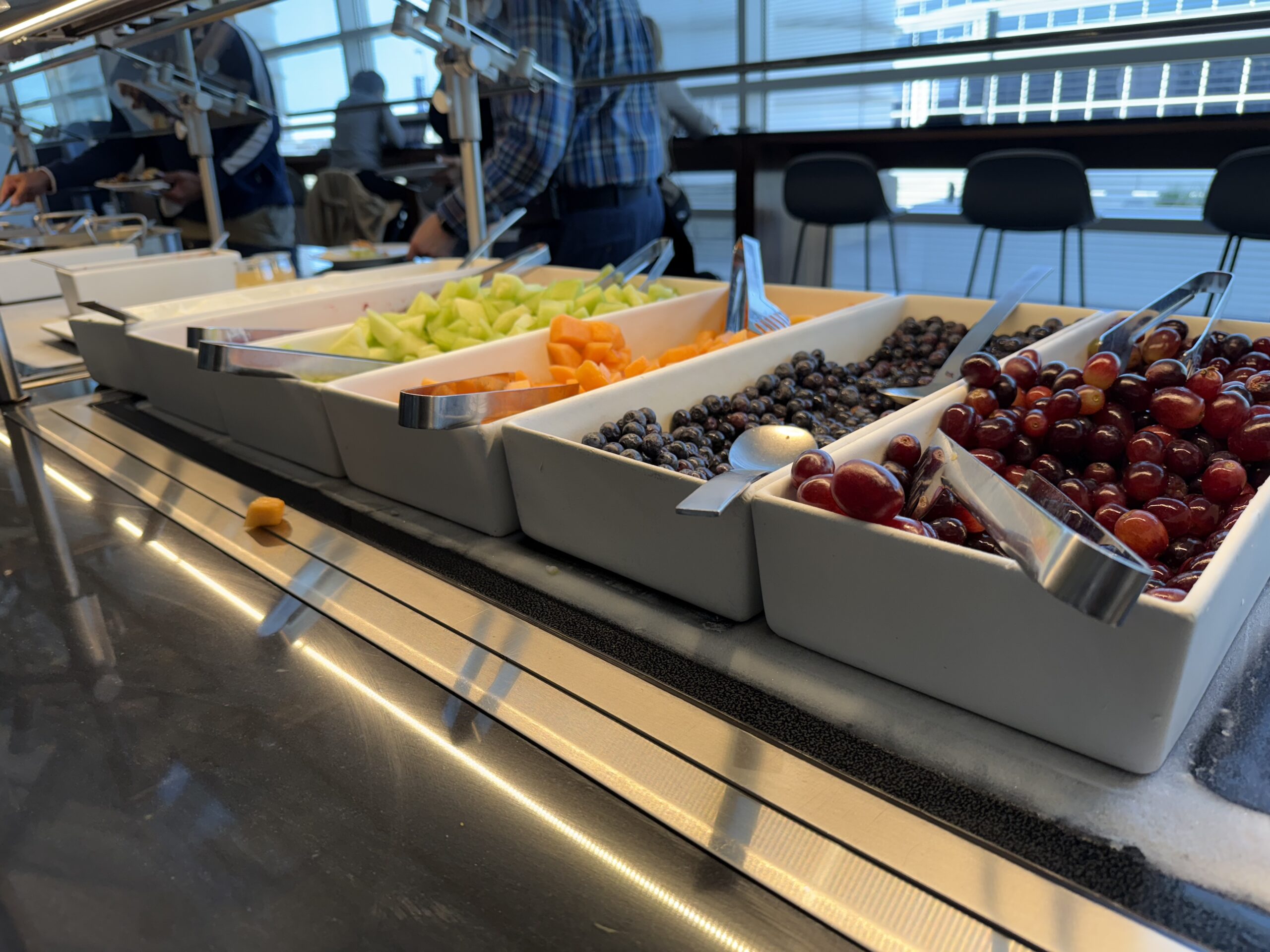 a row of bowls of fruit