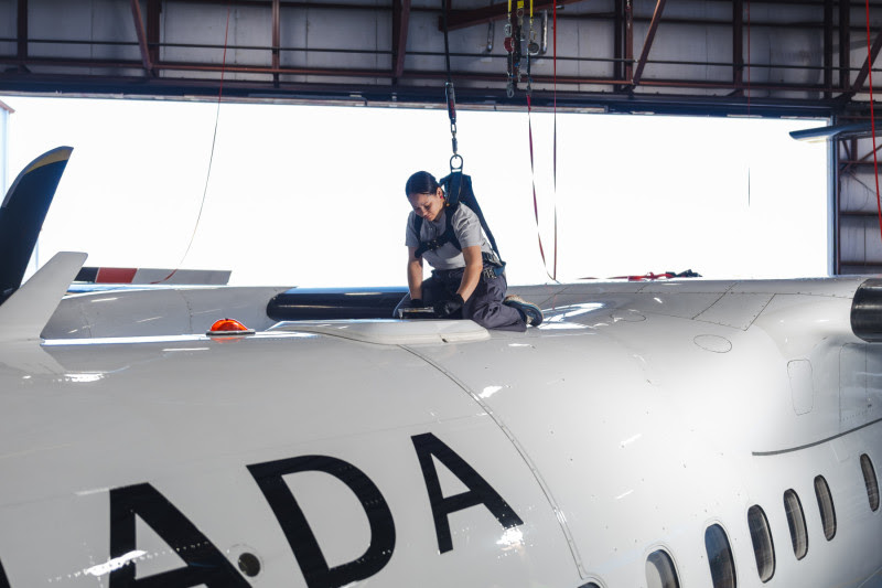a man working on a plane