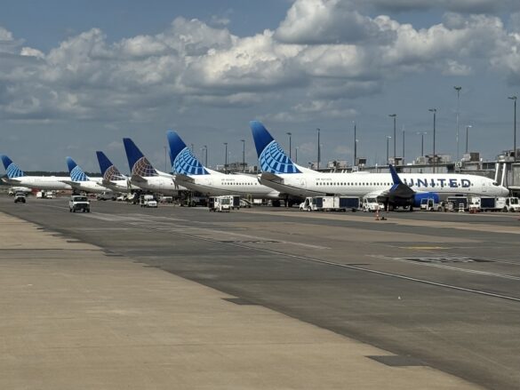 a group of airplanes parked on a runway