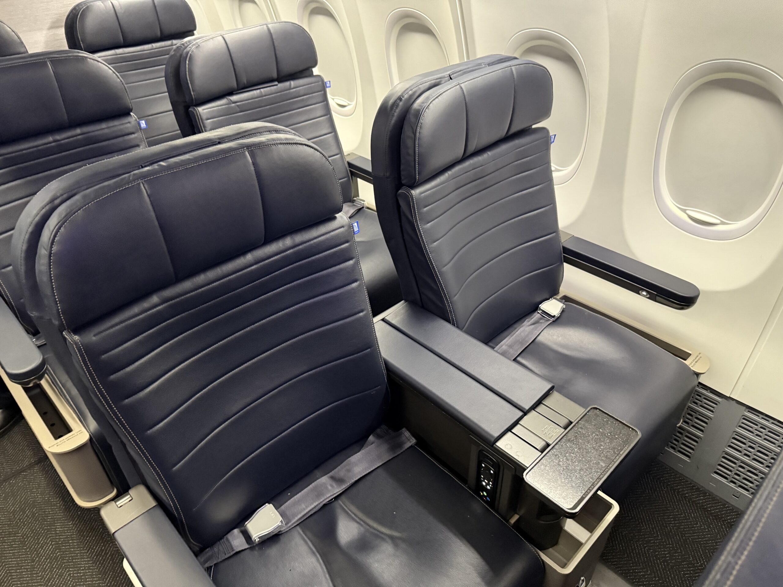 United First 737 Max a row of black seats in an airplane