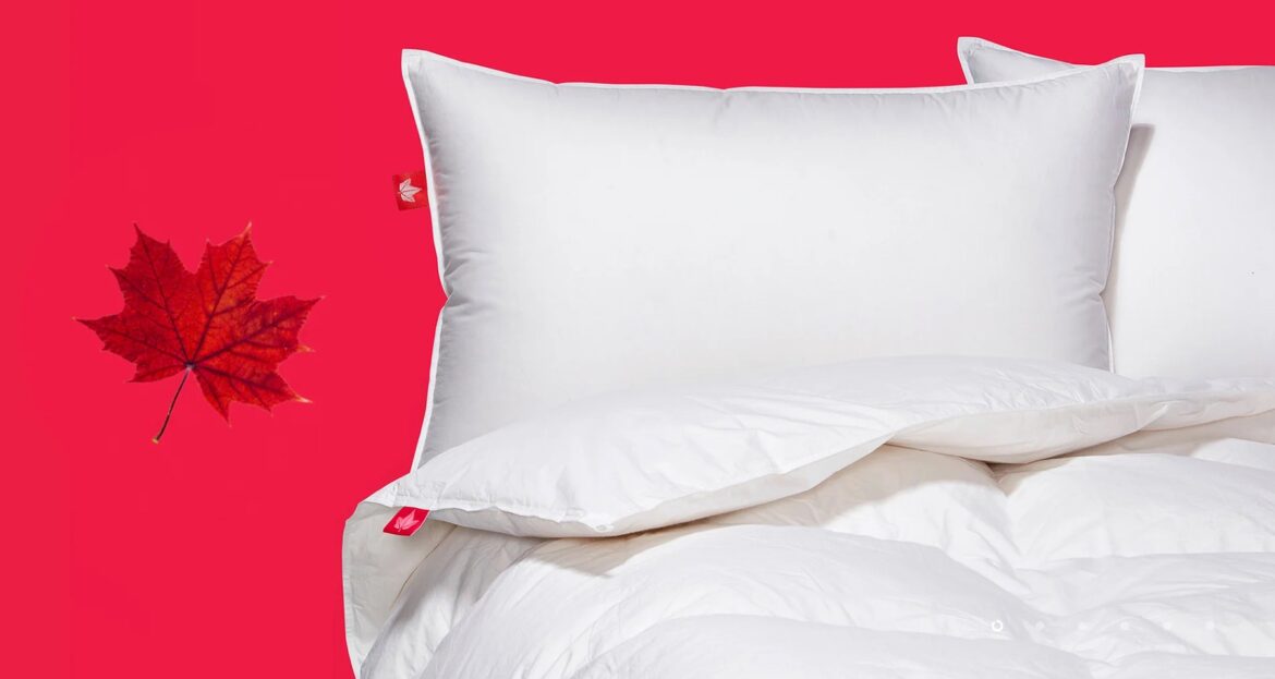 a white pillow on a bed