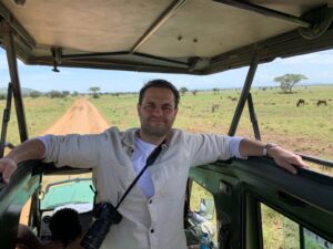 a man with a camera in a vehicle