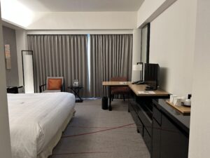 Sheraton Miyako Hotel Tokyo a bedroom with a bed and a desk