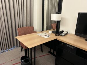 Sheraton Miyako Hotel Tokyo a desk with a telephone and a chair in a room