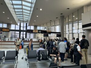 a group of people in an airport terminal