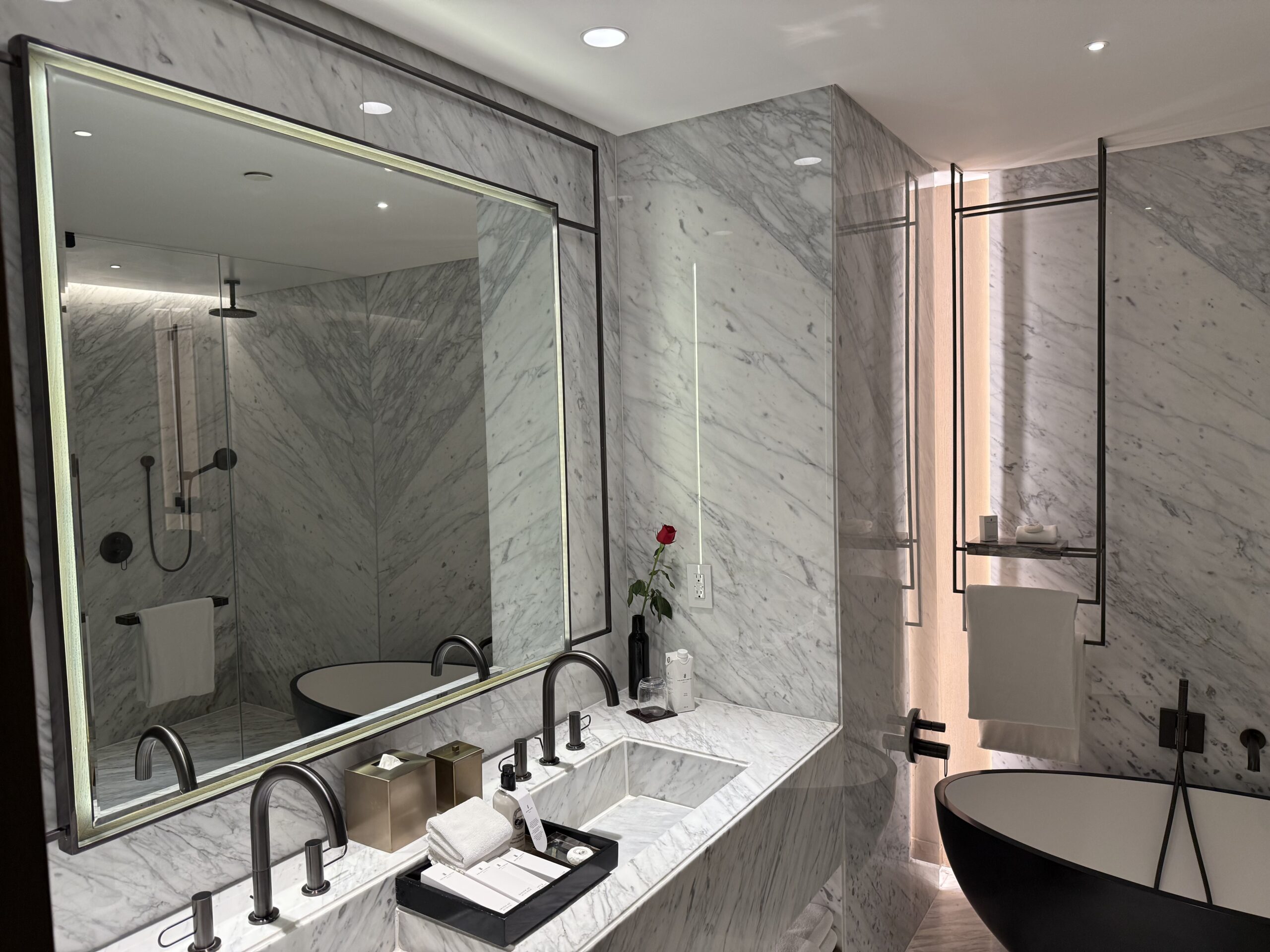 a bathroom with marble walls and a sink