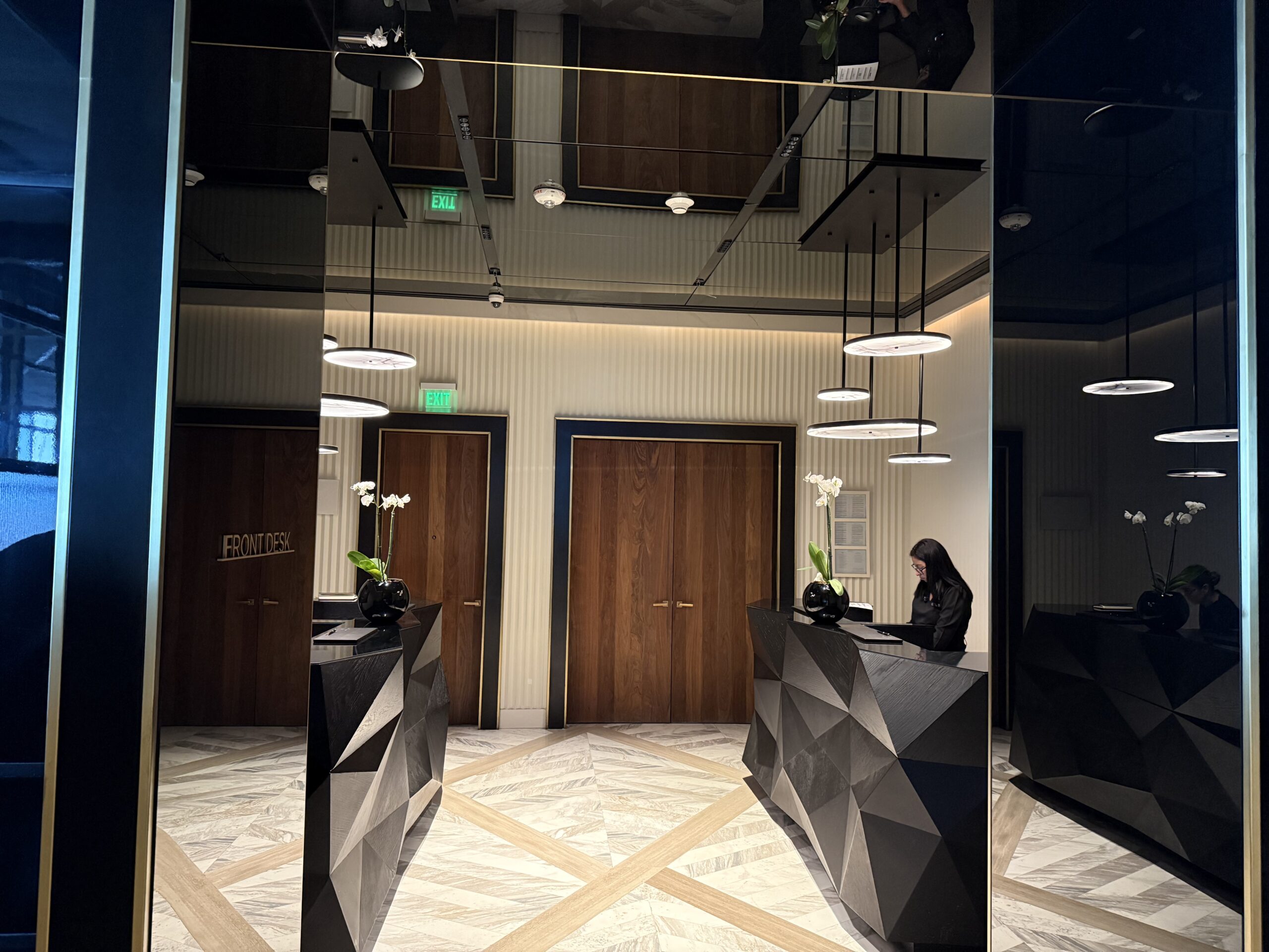 a woman standing at a reception desk