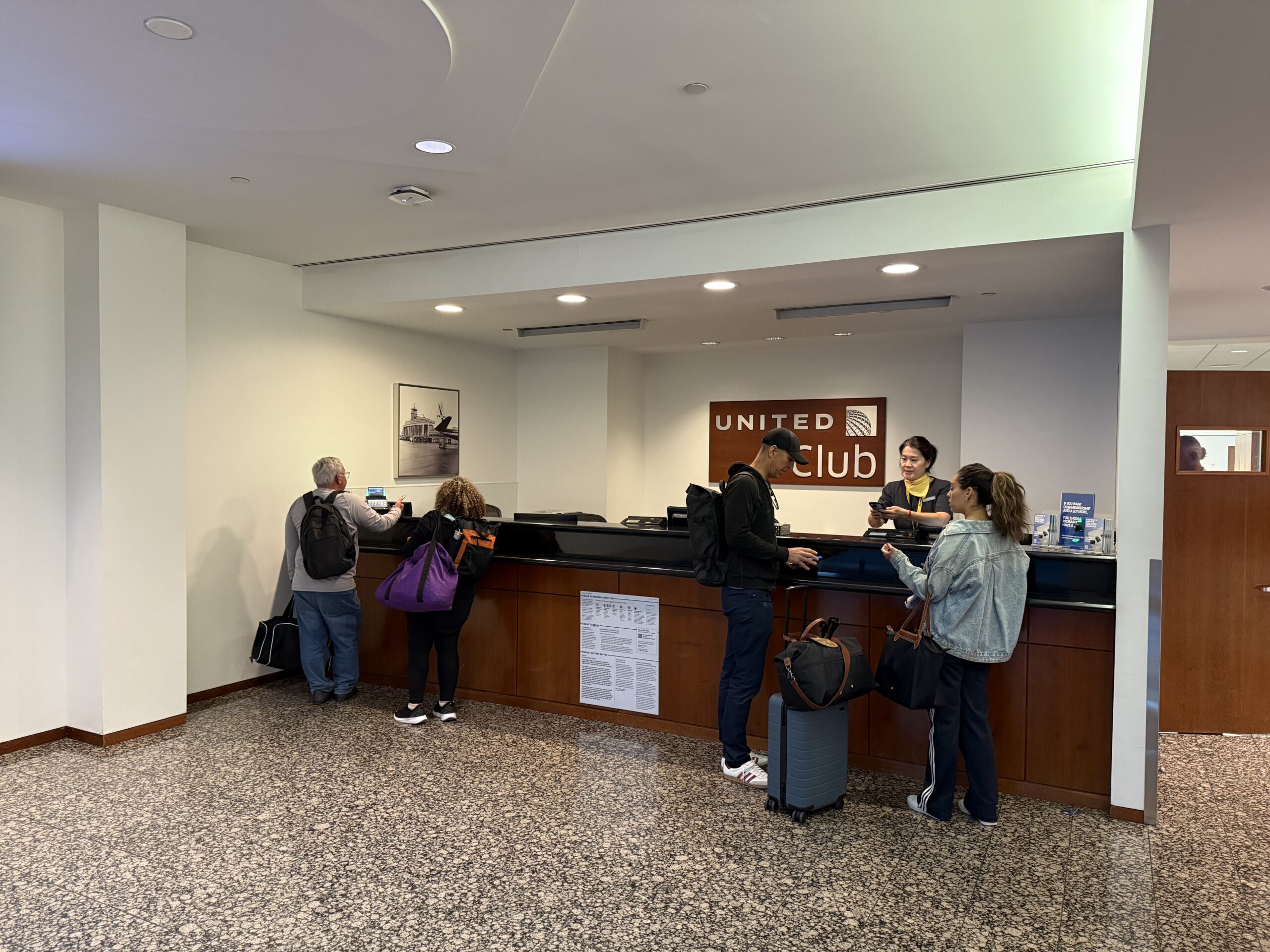 a group of people standing in front of a counter