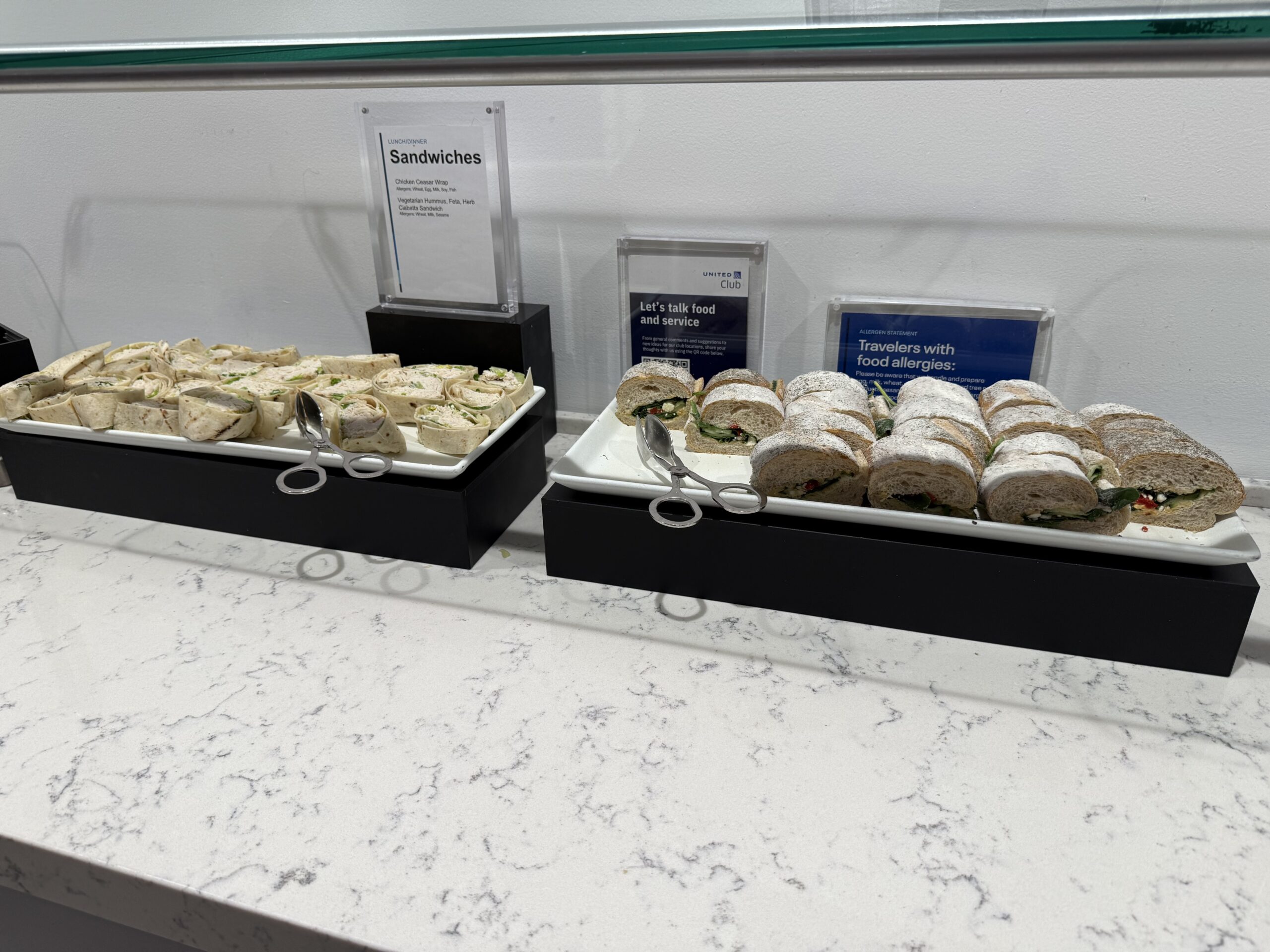 sandwiches on a counter with sandwiches on it