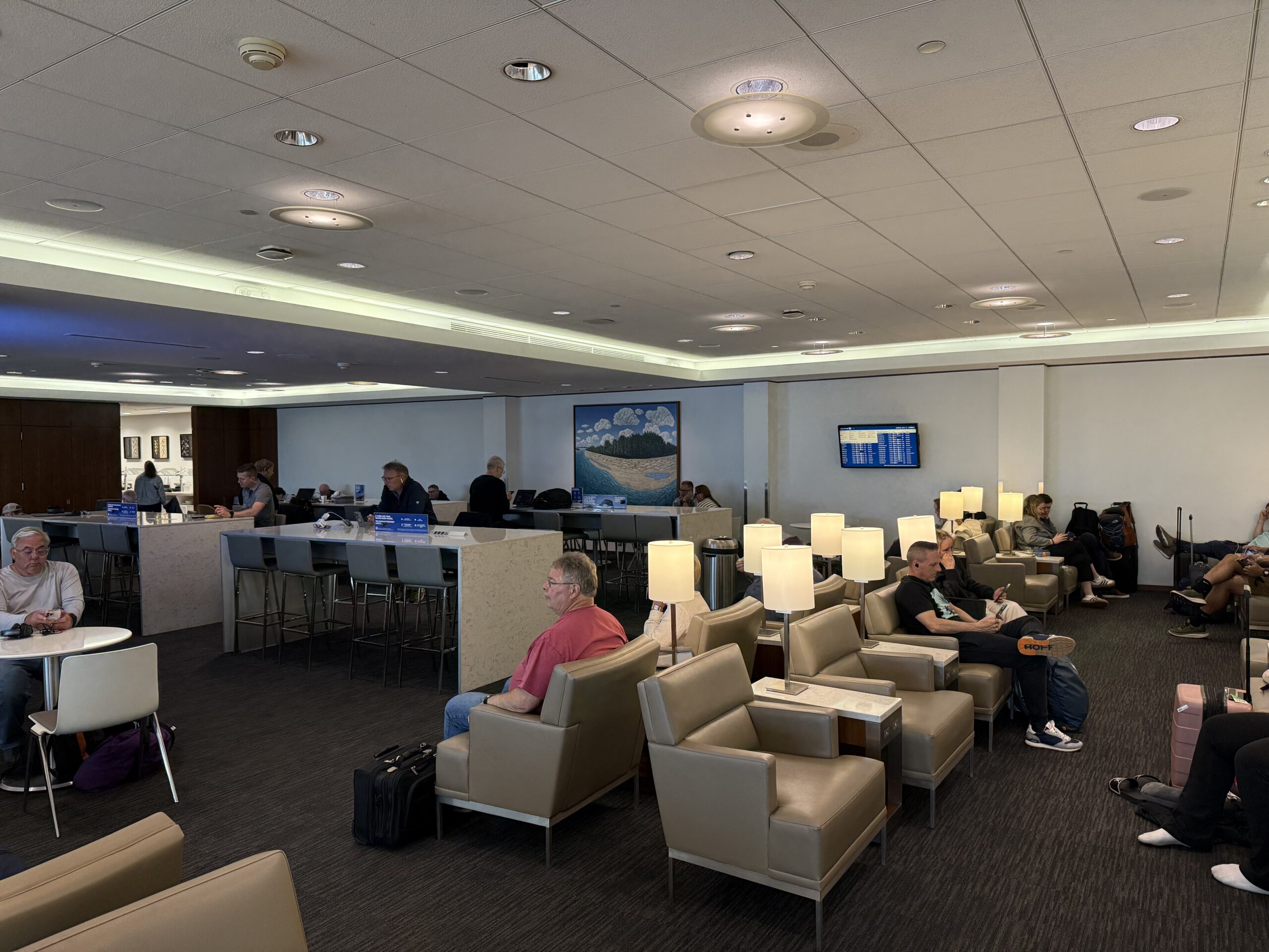 a group of people sitting in chairs in a room