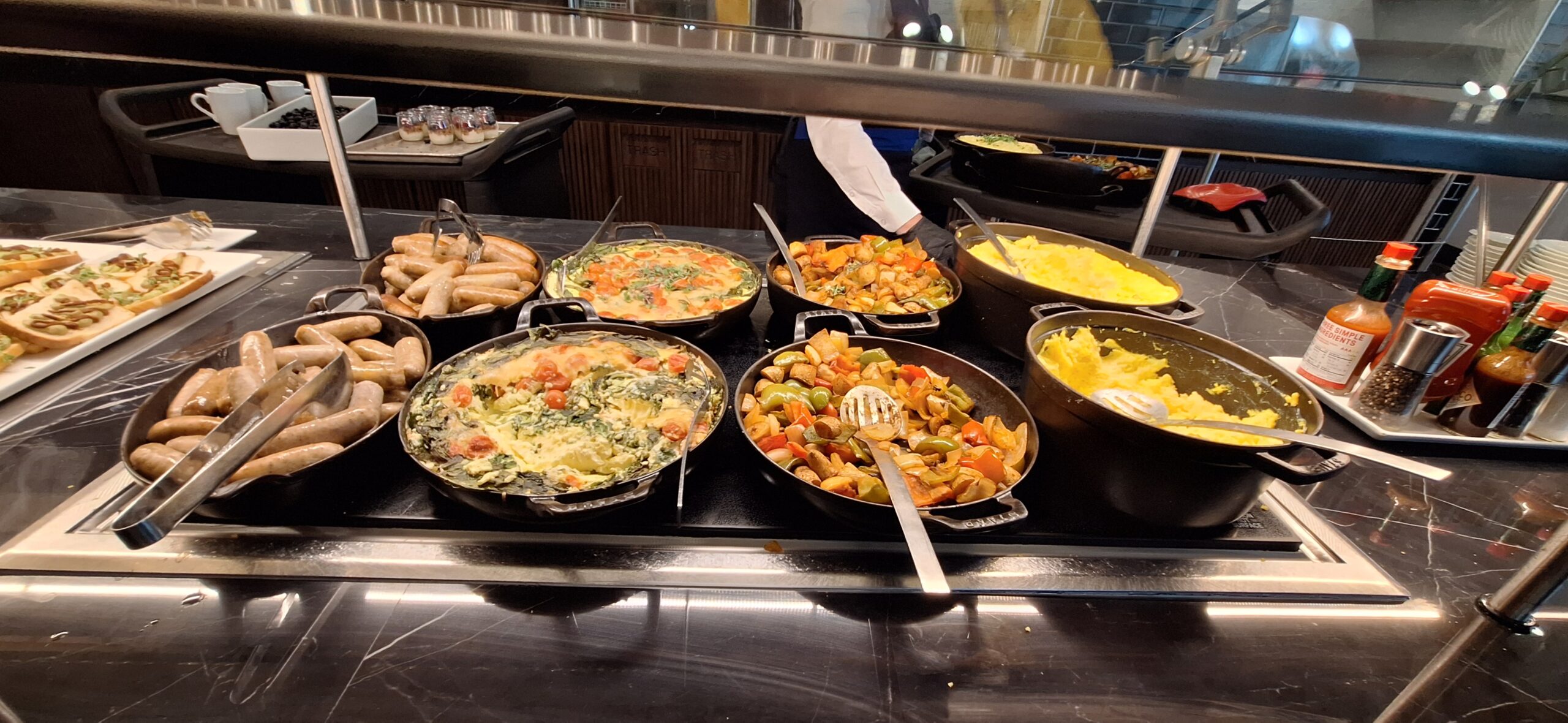 Centurion Lounge Las Vegas a group of pans of food