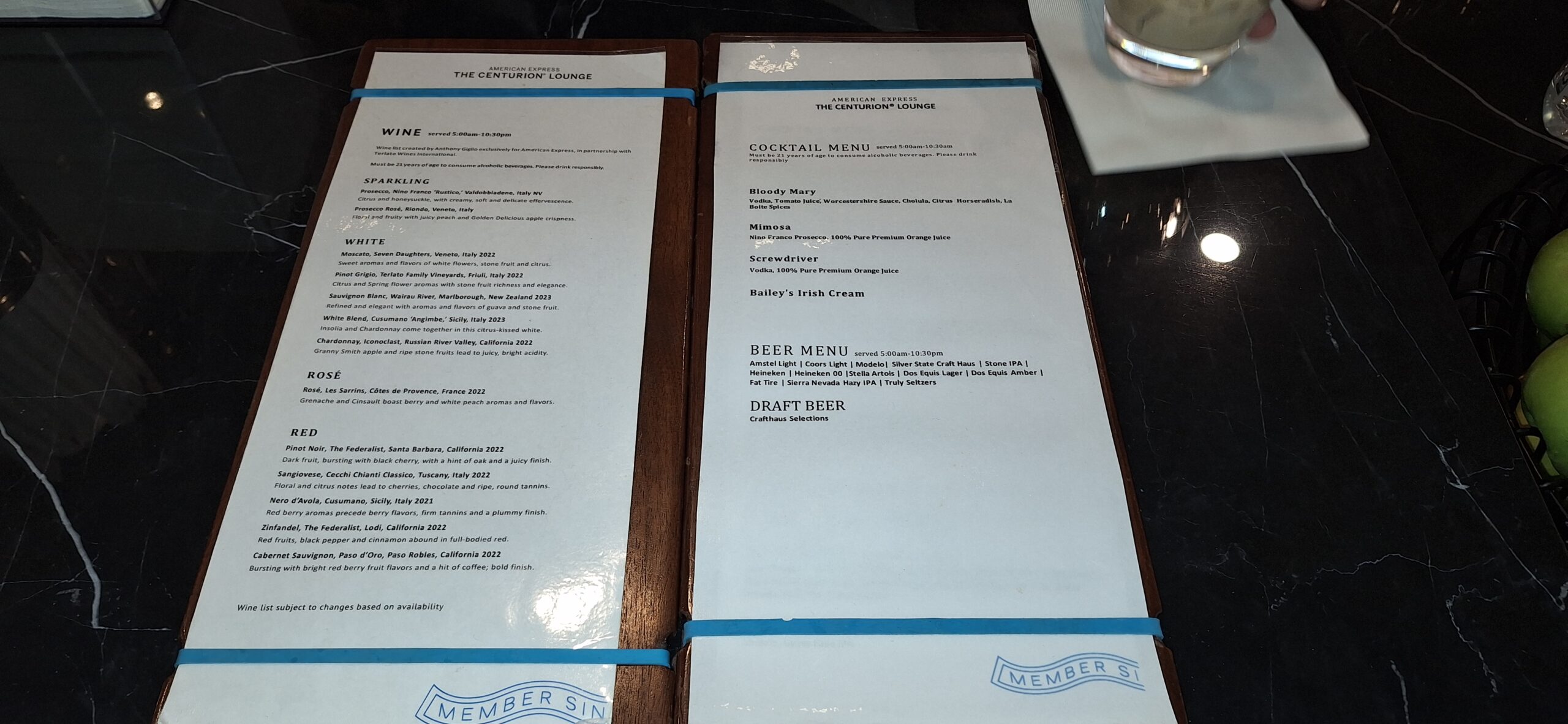 Centurion Lounge Las Vegas a menu with rubber bands on a table